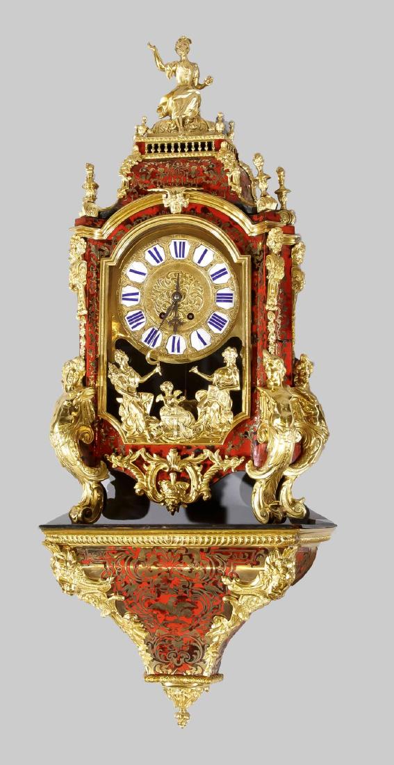 Large boulle clock w: Large boulle clock with matching wall console, 2nd half 19th century, reddish lacquer richly decorated with fire-gilded applications such as rocailles, mascarons and a sitting lady, in the lower part