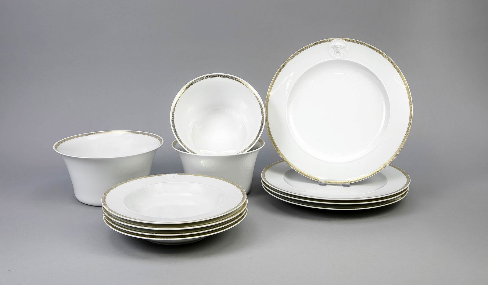Eleven parts Versace, Rosenthal, late 20th cent.,: Eleven parts Versace, Rosenthal, late 20th cent., Icarus form, Paul Wunderlich design, Méandre d'or medallion decor, white in the bottom, Medusa medallions in white biscuit, Meanderband in gold