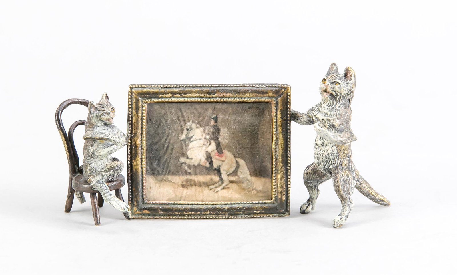 Franz Xaver Bergmann: Franz Xaver Bergmann (1861-1936), Viennese bronze 1st half of the 20th century, two cats presenting a painting (print) of a rising horse, polychrome cold painted bronze, above, on the reverse, 3 x 12