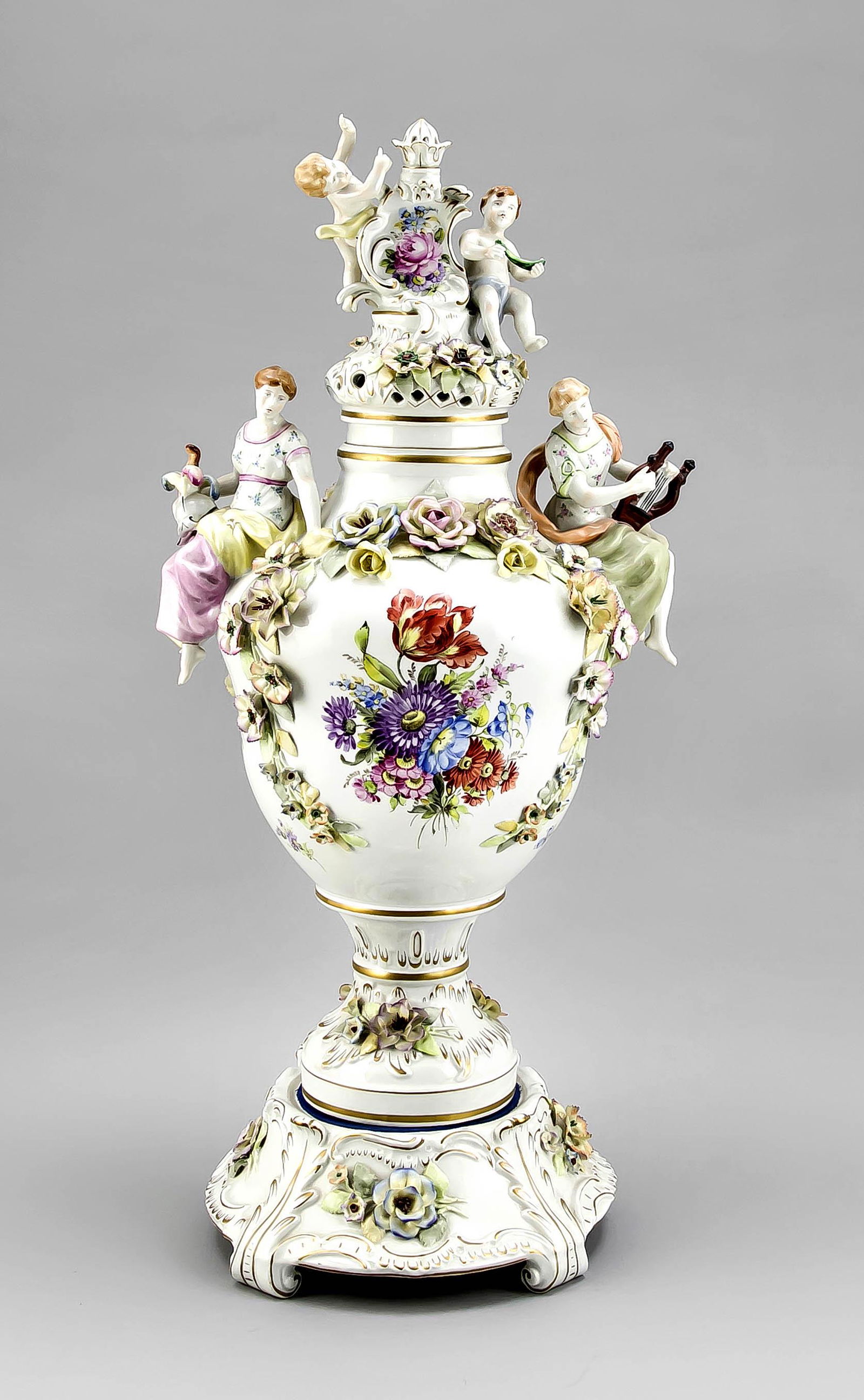 Large lidded vase, Plaue,: Large lidded vase, Plaue, Thuringia, after 1973, baluster vase on pedestal with three-dimensional flower trimmings, allegorical figures on the sides, lids with cupids and others. Crown, polychrome pai