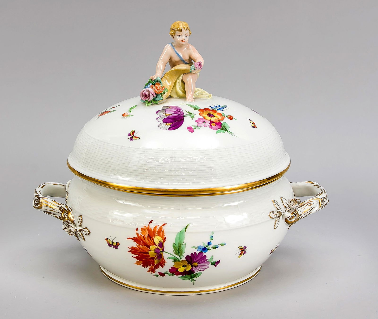 Lidded terrine, KPM Berli: Lidded terrine, KPM Berlin, beginning 20th century, 2nd quality, form Ozier, polychrom painting with German flowers and insects, decorative gilding, putto with cornucopia sitting on the lid, h. 28 cm,