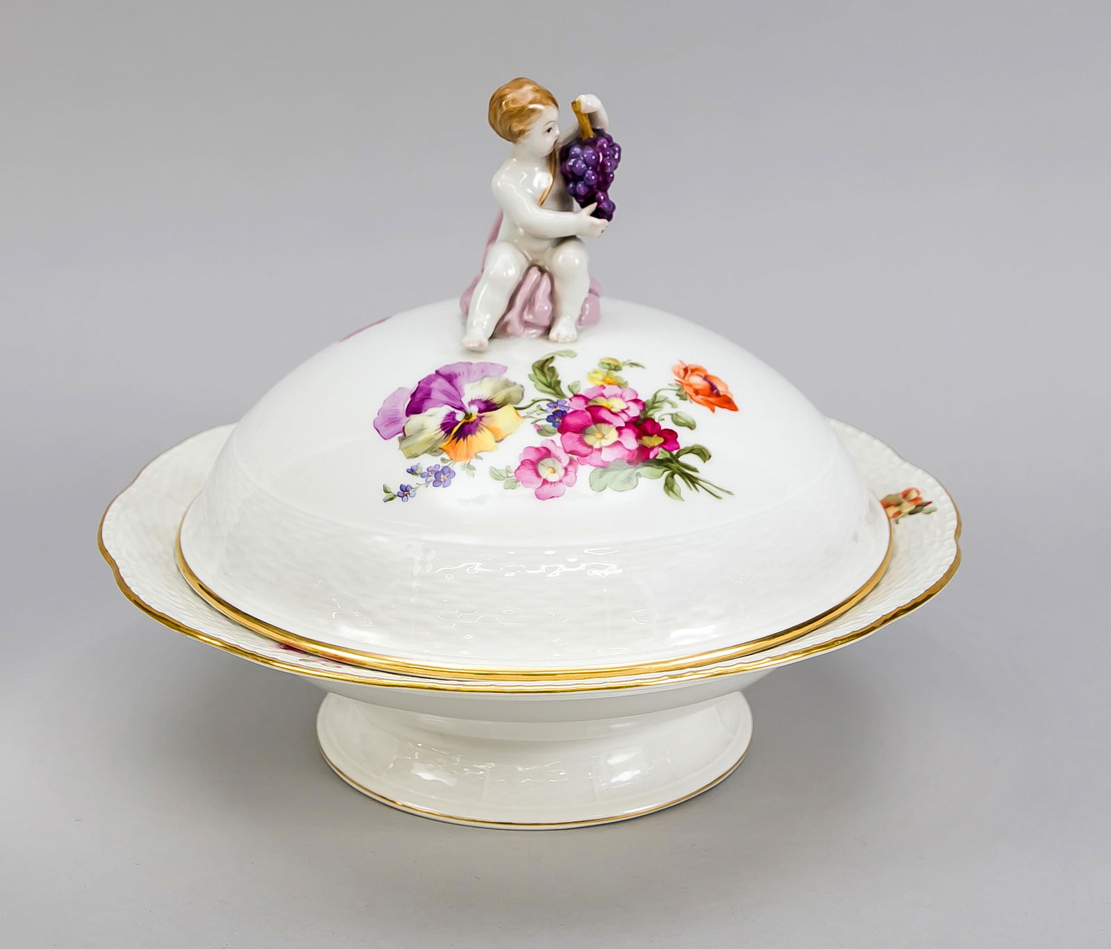 Lid terrine, KPM Berlin,: Lid terrine, KPM Berlin, beginning 20th century, 1st quality, red painters mark, form Ozier, polychrome flower and insect painting, gold rim, putto with grapes sitting on the lid, Ø 27.5 cm, H. 2