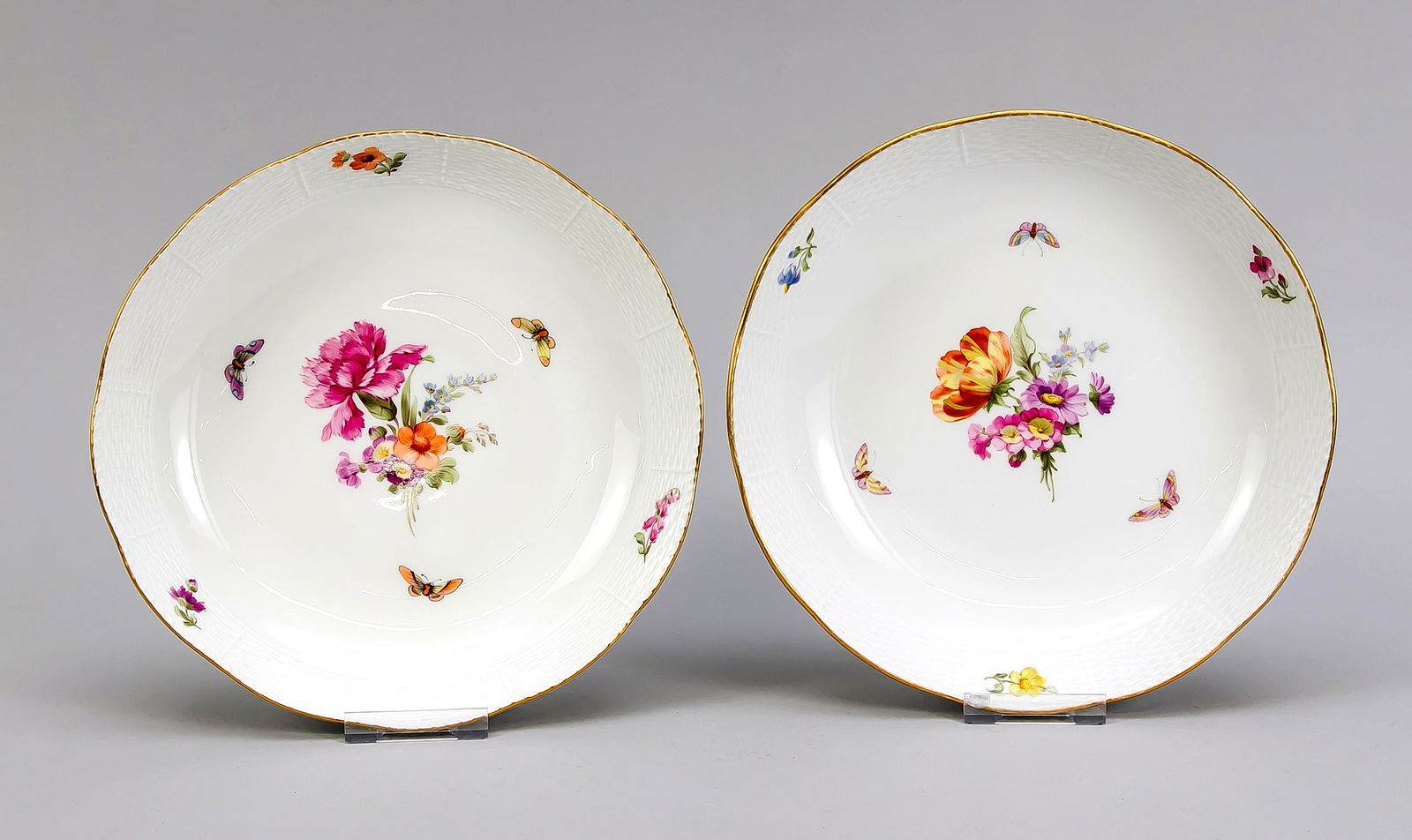 Two round bowls, KPM Berl: Two round bowls, KPM Berlin, beginning 20th century, 1st quality, red painters mark, form Ozier, polychrome flower and insect painting, gold rim, Ø 23.5 cm