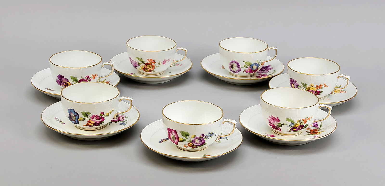 Seven cups with saucers,: Seven cups with saucers, KPM Berlin, beginning 20th century, 1st quality, red painters mark, form Ozier, polychrome flower and insect painting, gold rim, h. 7 cm