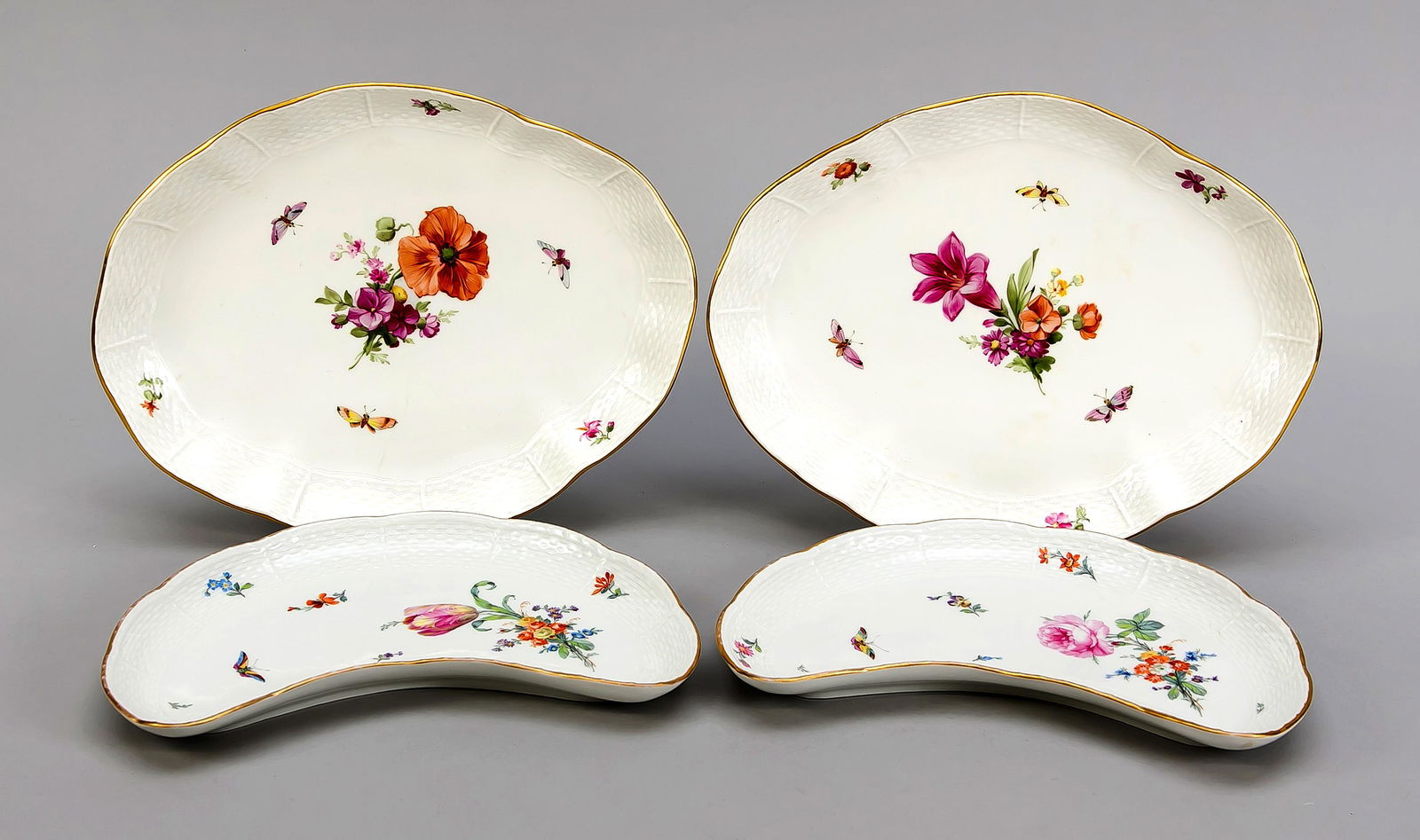 Four bowls, KPM Berlin, b: Four bowls, KPM Berlin, beginning 20th century, red painters mark, form Ozier, polychrome flower and insect painting, gold rim, 2 boning bowls, 2nd quality, gold rim partly rubbed off, L. 23 cm, 2 ova