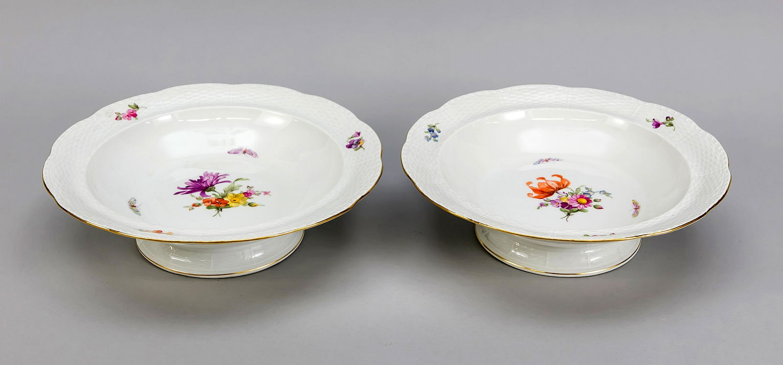 Two foot bowls, KPM Berli: Two foot bowls, KPM Berlin, beginning 20th century, 1st quality, red painters mark, form Ozier, polychrome flower and insect painting, gold rim, Ø 27.5 cm