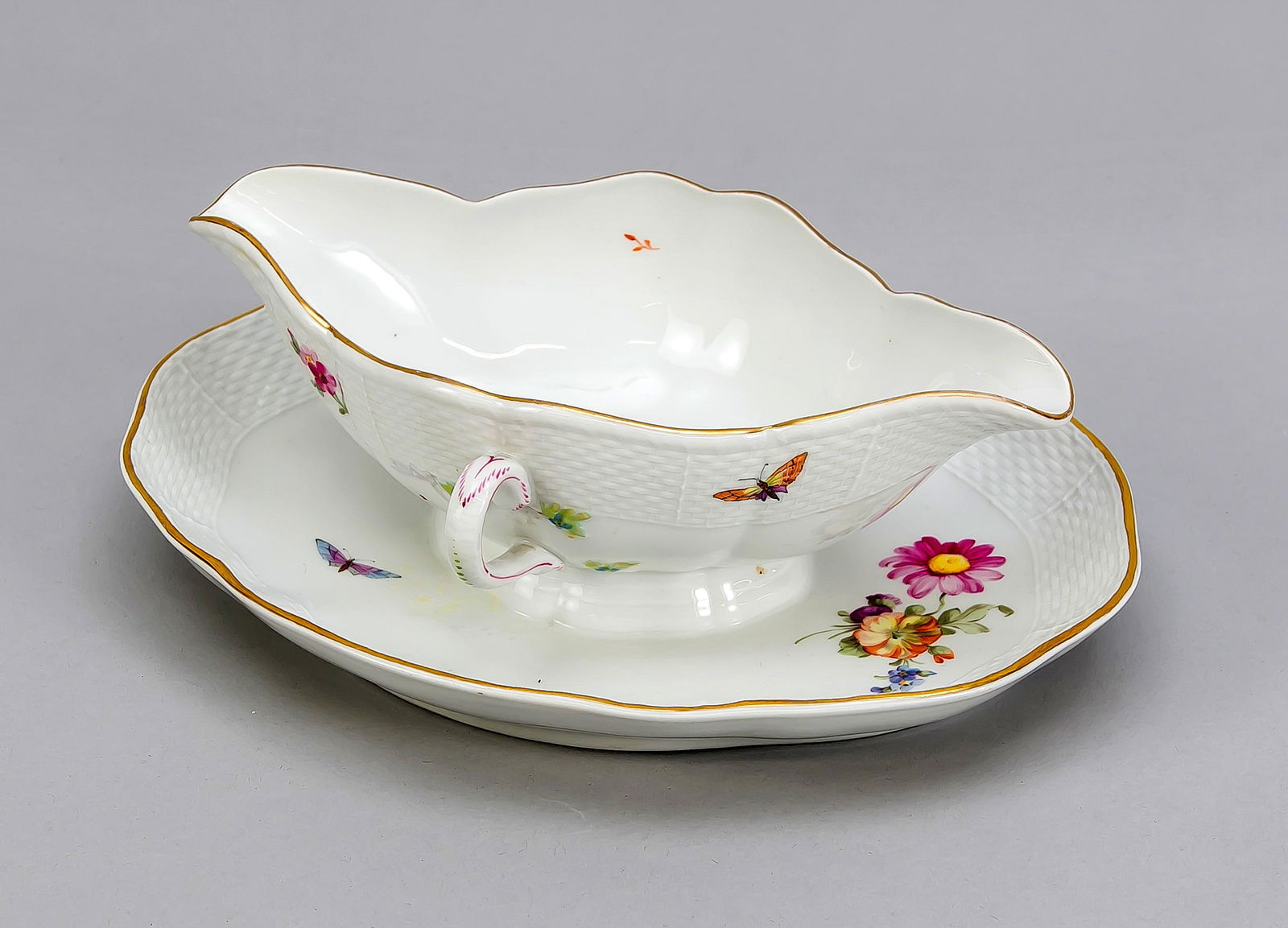 Sauciere, KPM Berlin, yea: Sauciere, KPM Berlin, year letter for 1921, 1st quality, red painters mark, form Ozier, fine polychrome painting with German flowers and insects, gold rim, L. 26 cm