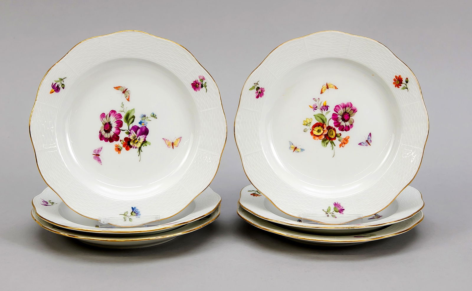 Six cake plates, KPM Berl: Six cake plates, KPM Berlin, beginning 20th century, 1st quality, red painters mark, form Ozier, polychrome flower and insect painting, gold rim, Ø 17.5 cm