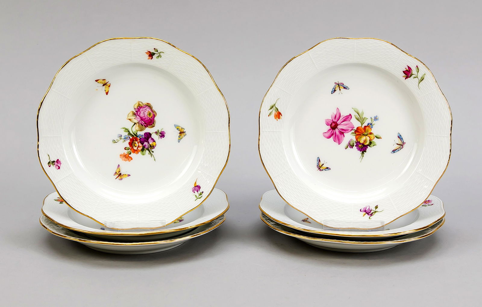 Six cake plates, KPM Berl: Six cake plates, KPM Berlin, beginning 20th century, 1st quality, red painters mark, form Ozier, polychrome flower and insect painting, gold rim, Ø 17.5 cm