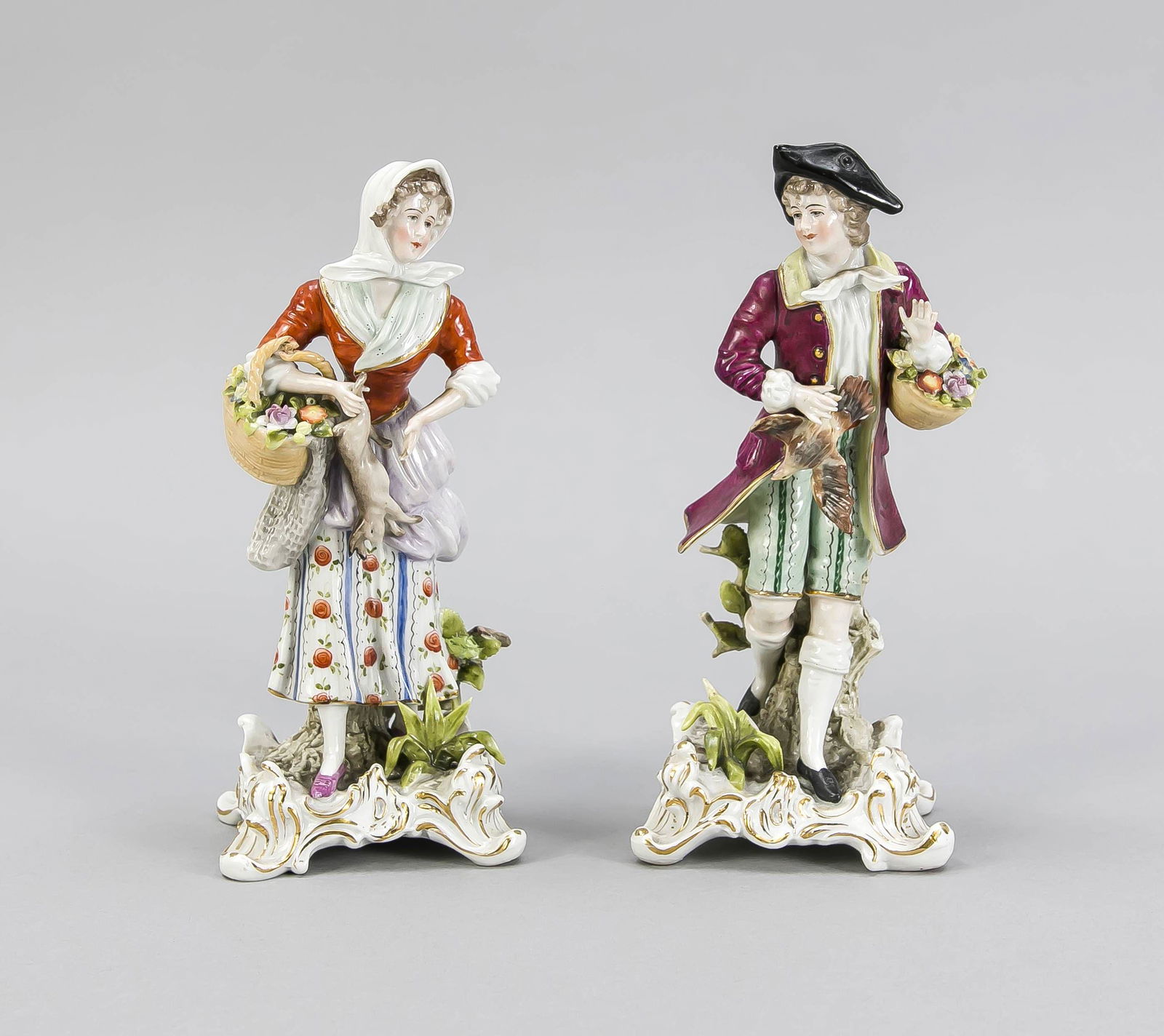 Pair of game sellers, Sitzendorf, T: Pair of game sellers, Sitzendorf, Thuringia, early 20th c., elegant gentleman with flower basket and game bird u. Maid with hare and flower basket, on curved bases, polychrome painted and ornamental g