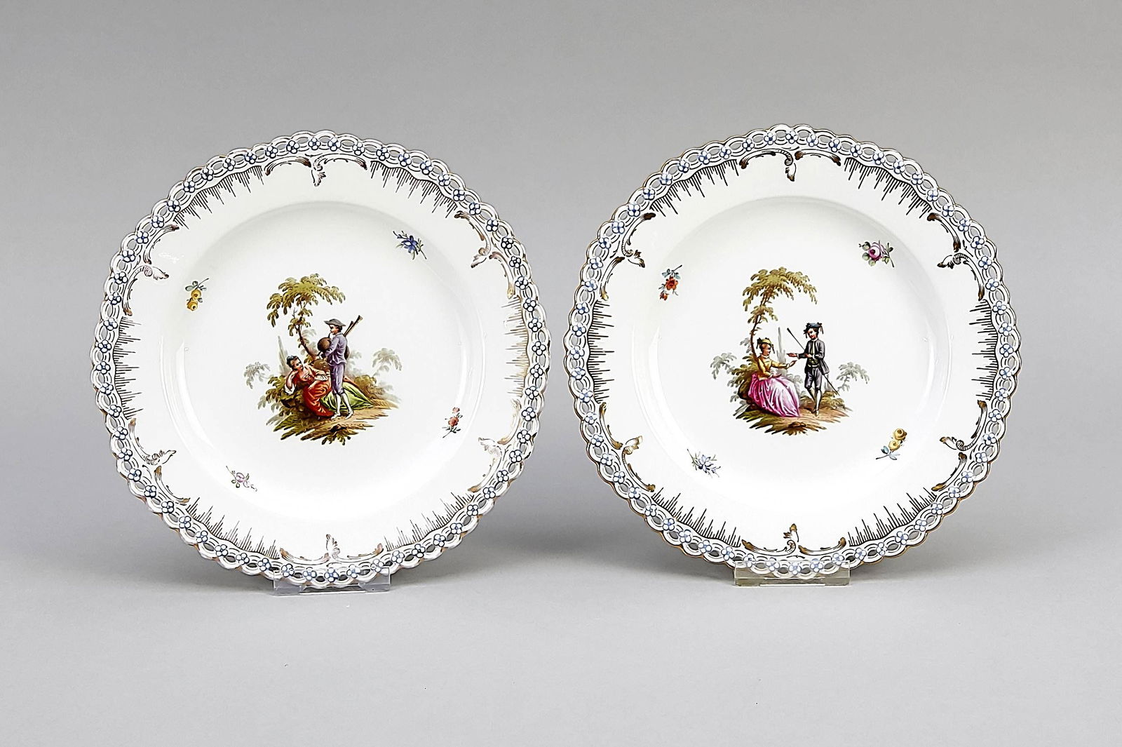 Two picture plates, KPM Berlin, mar: Two picture plates, KPM Berlin, mark before 1945, 1st choice, form Neuzierat with openwork edge, set with forget-me-not flowers, in the mirror polychrome painting with gallant scenes after Wateau, orn
