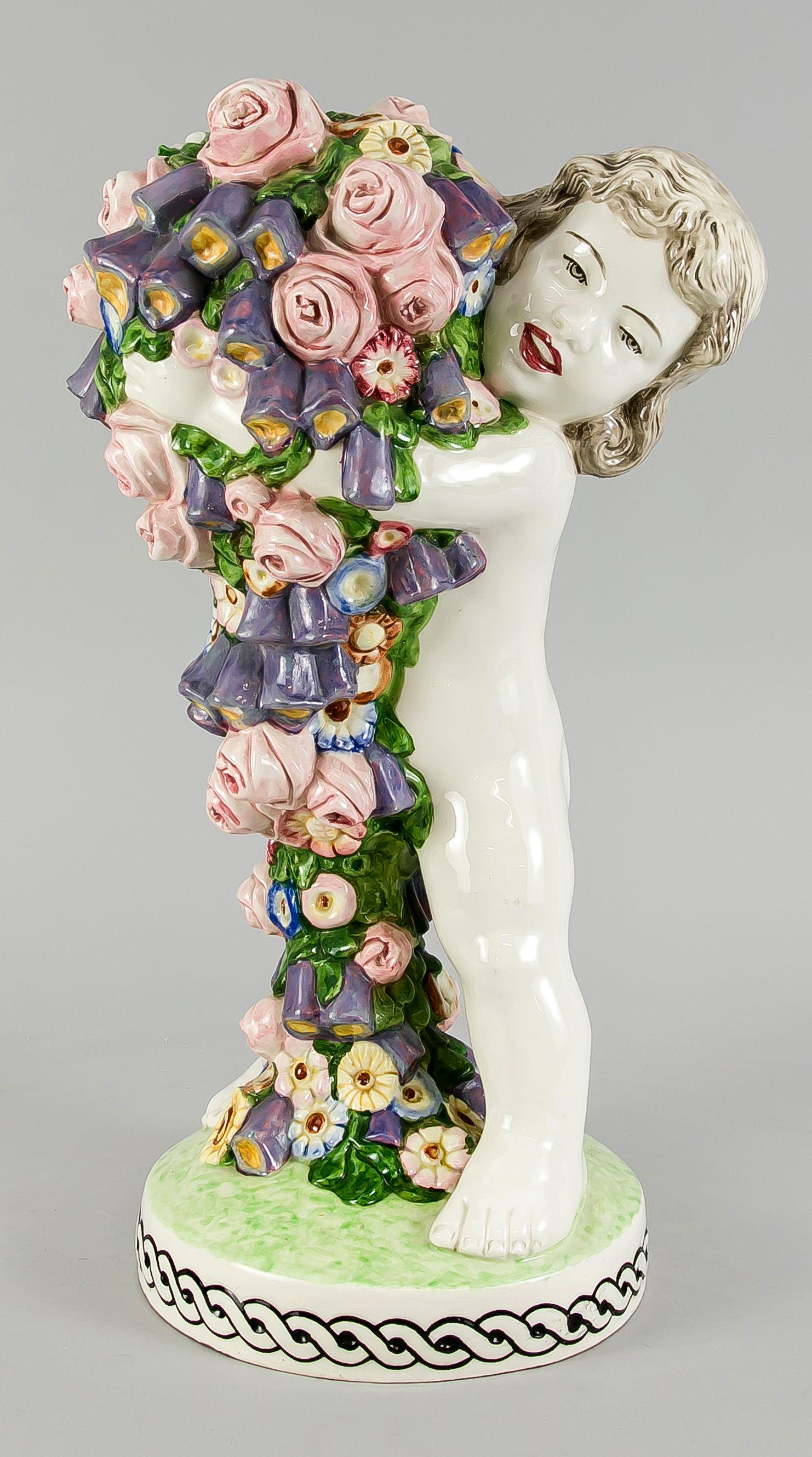 Putto with flower garland, probably: Putto with flower garland, probably Bernard Bloch, Eichwald, c. 1910-20, designed by Carl Klimt (Teplice 1876-1945 Zinnwald), model no. 9389, ceramic, light body, polychrome painted, putto, carrying a