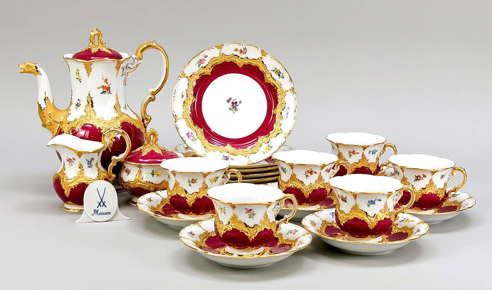 Coffee service for 6 persons, 22 pi: Coffee service for 6 persons, 22 pieces, Meissen, brand after 1950, 2nd choice, B-shape, relief decoration splendidly gilded, white with scattered flowers as well as bordeaux red background, coffee po