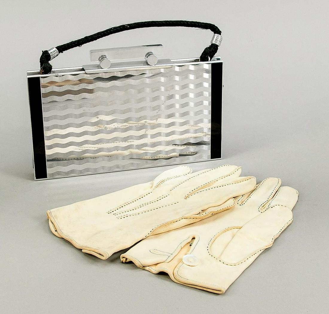 Art deco handbag and gloves, c. 192: Art deco handbag and gloves, c. 1920. Handbag geometrically designed with wave ornament of aluminum and black plastic, 14 x 22 cm. White ladies leather gloves. Both slightly rubbed