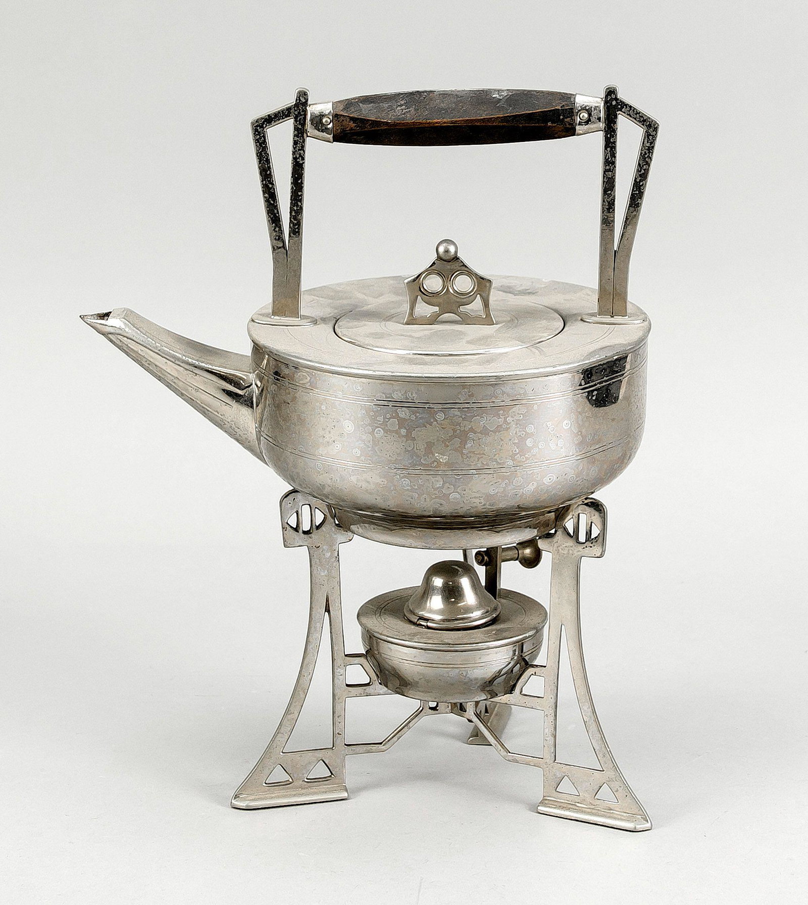Tea kettle on rachaud, c. 1900. chr: Tea kettle on rachaud, c. 1900. chrome plated, faceted wooden handle, slightly rubbed & bumped, slightly corroded, h. 31 cm.