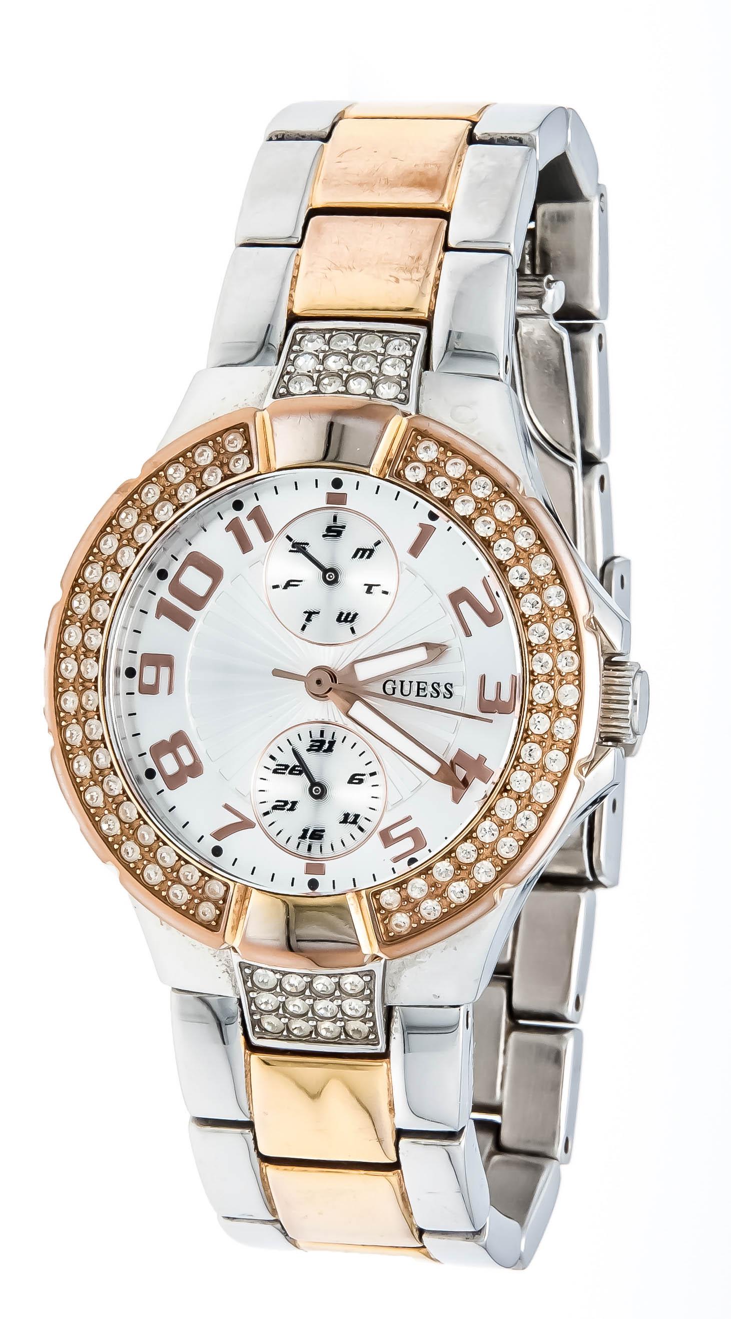 Guess bicolor rose/ steel, lad: Guess bicolor rose/ steel, ladies quartz watch, set with similies stones, ref. W15072L2, 50m wd, silverf. dial with arab. gold numerals, date and day of the week indication over small indicators at 6