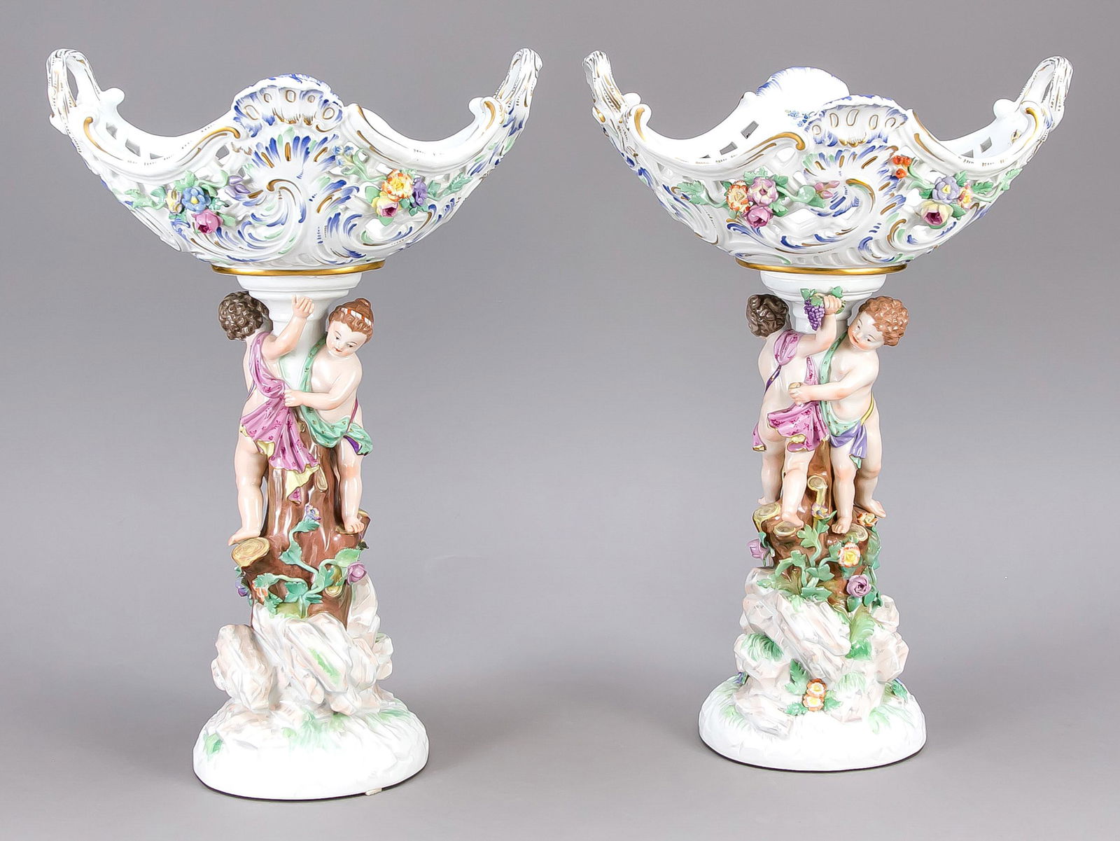 Pair of centerpieces, Meissen,: Pair of centerpieces, Meissen, mark after 1934, 3rd choice, w. after a design by Kaendler, in the year 1764-1766, model no. 80514 (old number A 59), on a rock base rising tree trunk, around it running
