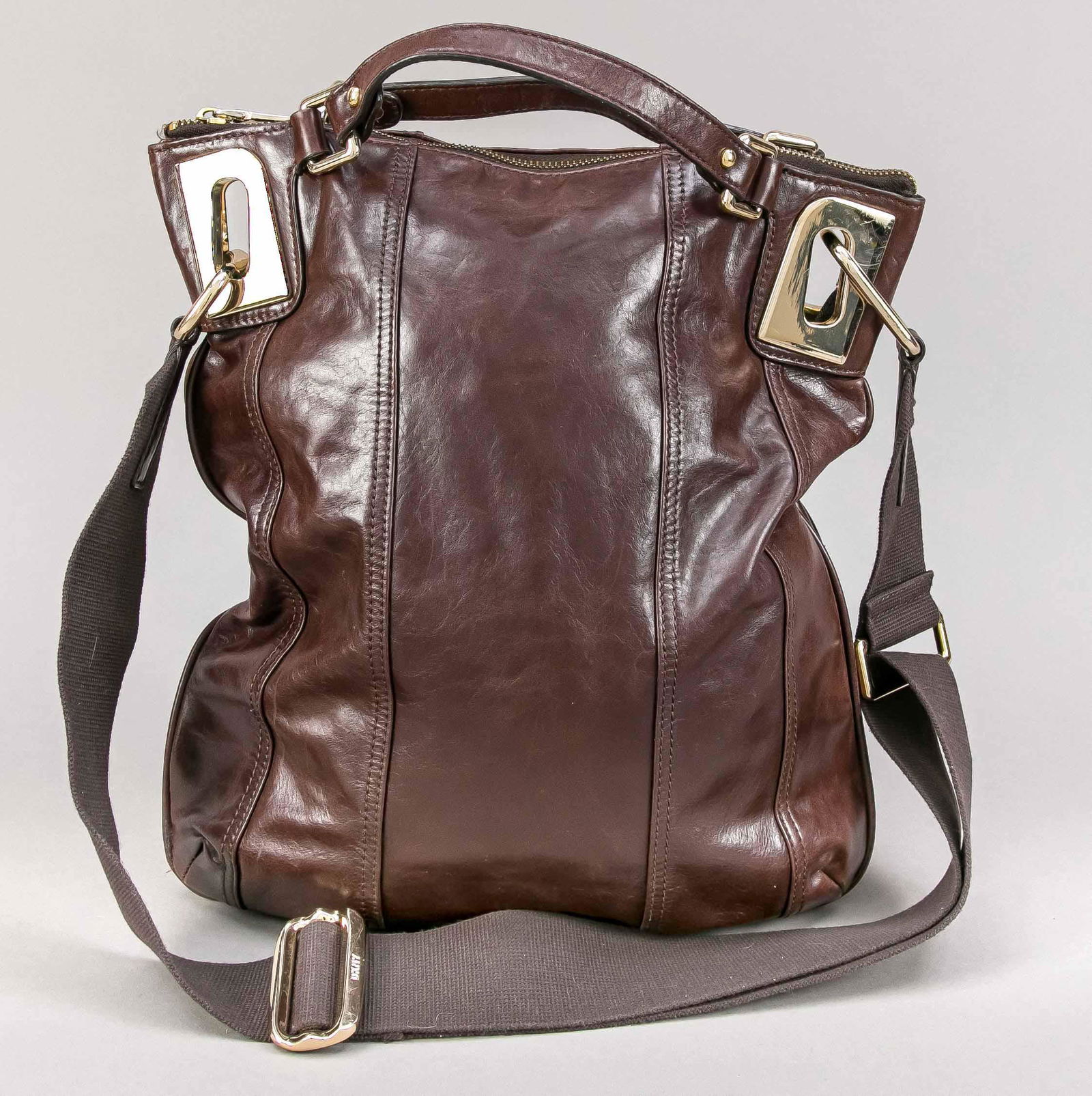 DKNY, tote bag, dark brown sof: DKNY, tote bag, dark brown soft smooth leather, silver-tone hardware, short double handles and detachable adjustable shoulder strap, textile interior, light signs of use and storage, approx. 37 x 33 x