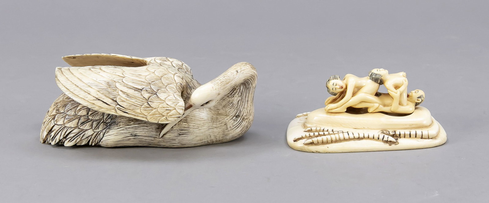 Erotic okimono, Japan, c. 19: Erotic okimono, Japan, c. 1900 (Meiji), in the form of a heron hosting a mÃ©nage-Ã -trois (consisting of 2 parts). Inscribed and signed under the bottom, ca. 7 x 14 x 8 cm.