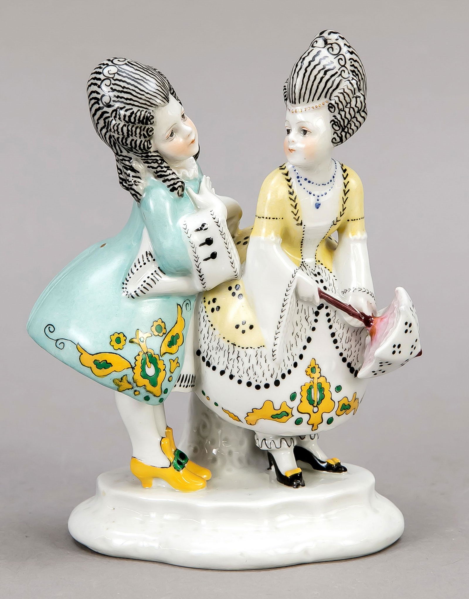 A pair of children in rococo d: A pair of children in rococo dresses, Goebel, Oeslau, 20th century, polychrome painted, h. 16 cm