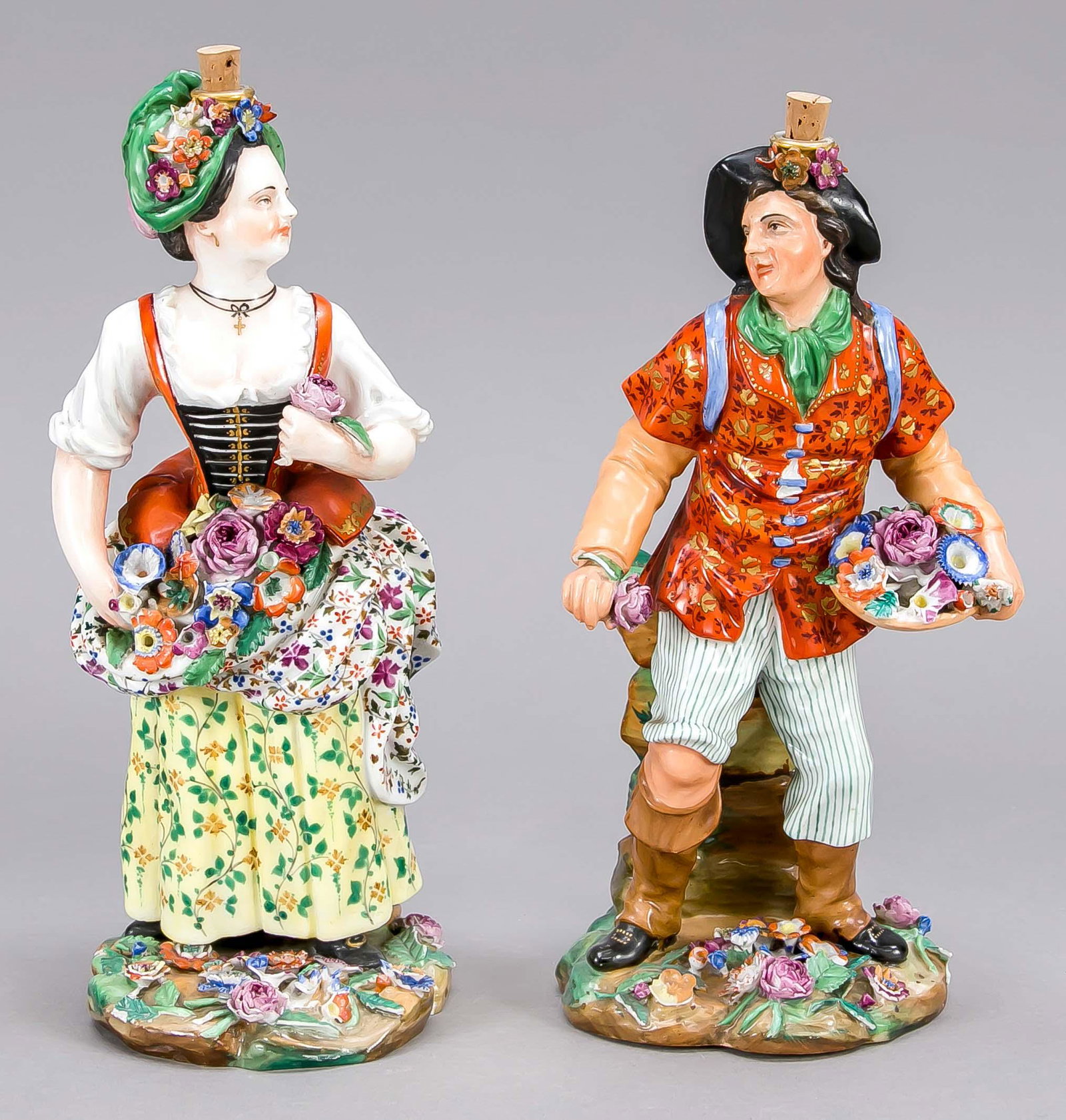 Pair of figural bottles, Franc: Pair of figural bottles, France, 19th c., Jacob Petit, standing man and standing woman with baskets of flowers, polychrome painted, gold staffage, minimally bumped, h. to 24 cm.