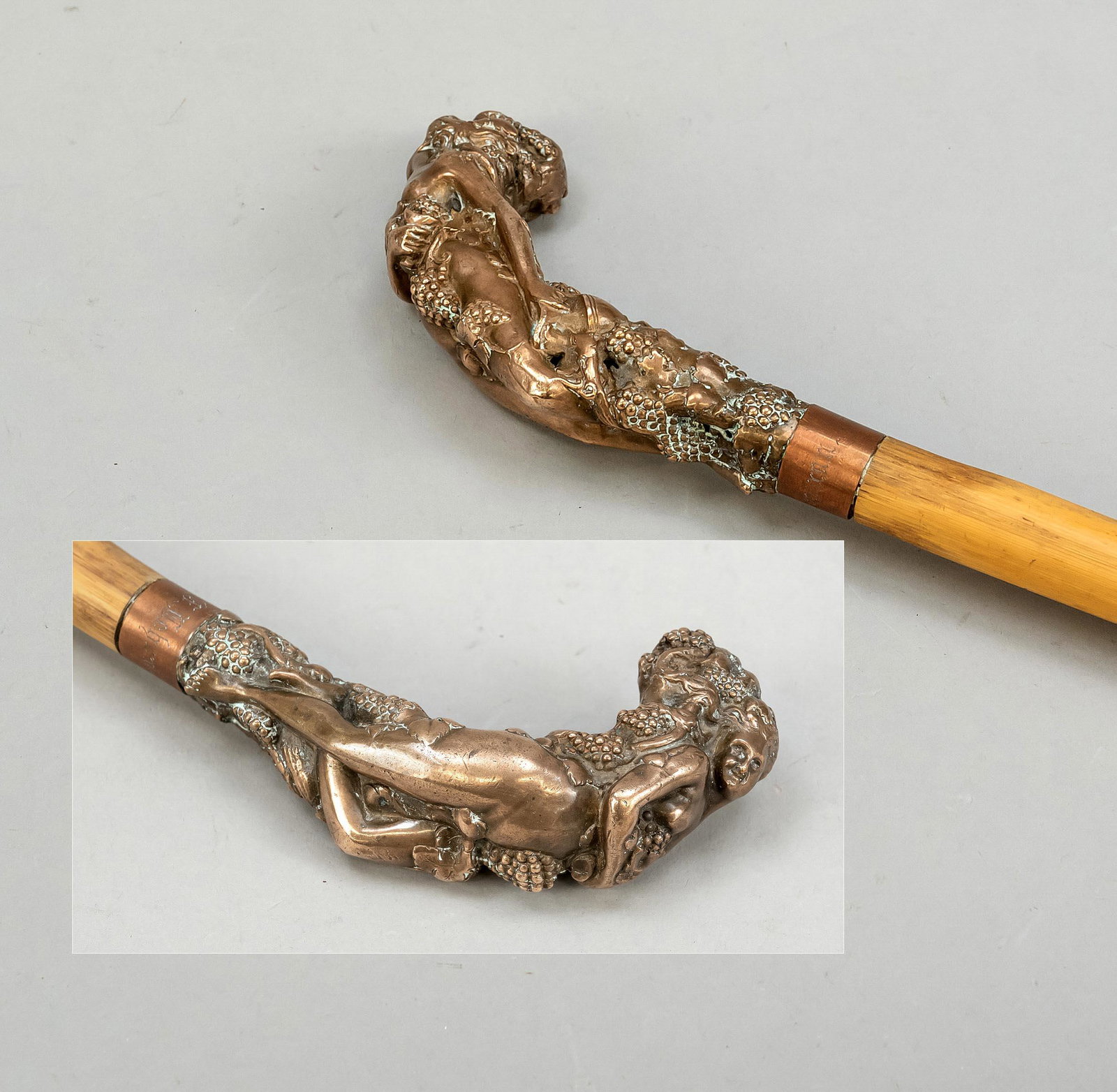 Walking stick with erotic hand: Walking stick with erotic handle, late 19th c. Curved handle as a reclining nude surrounded by grapes, cuff engraved with name, bamboo shaft, metal tip, l. 87 cm
