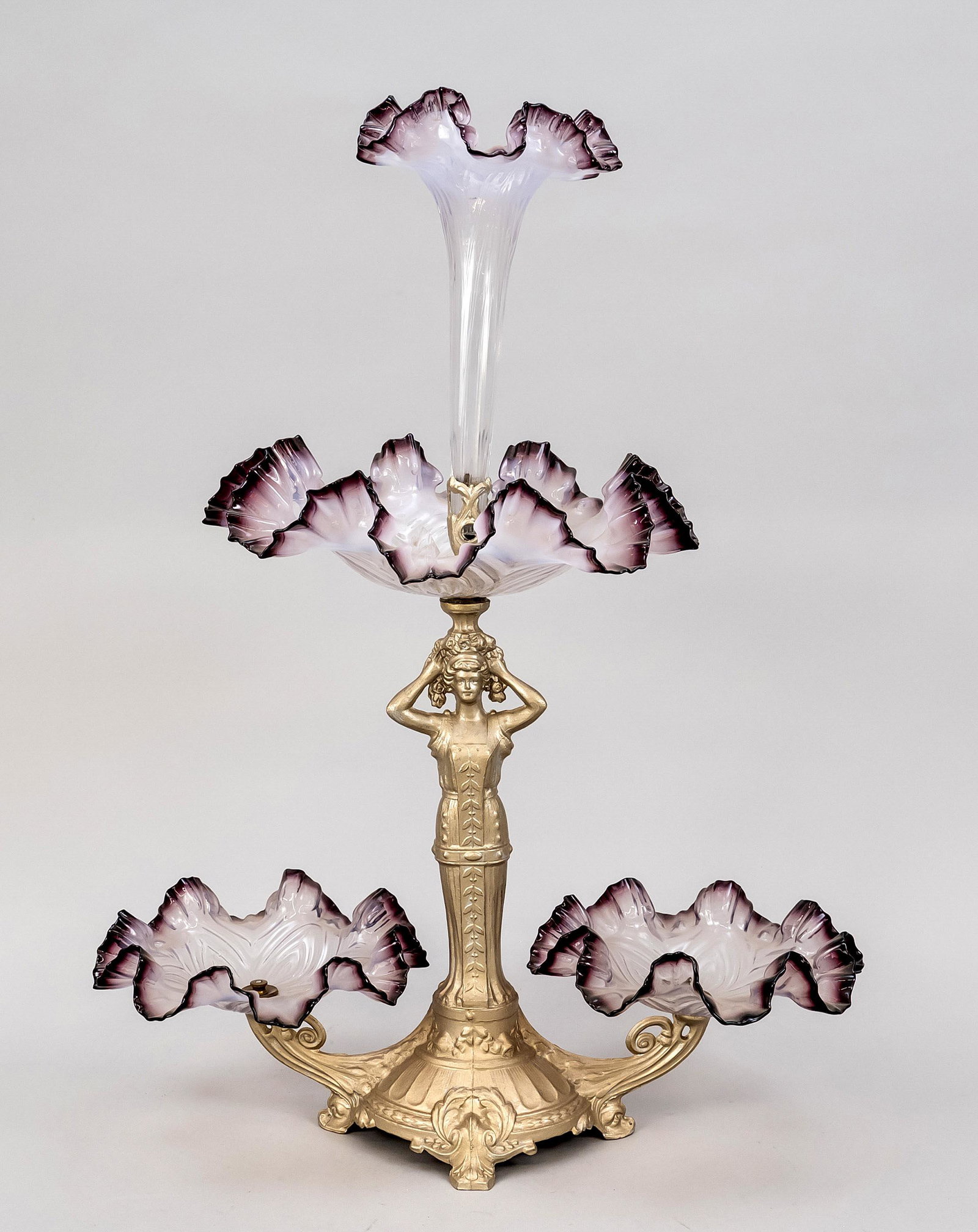 Centerpiece, early 20th centur: Centerpiece, early 20th century, cast metal and colored glass. Ornamented base on 4 feet with figural shaft, glass bowls in the shape of flowers, h. 56 cm.