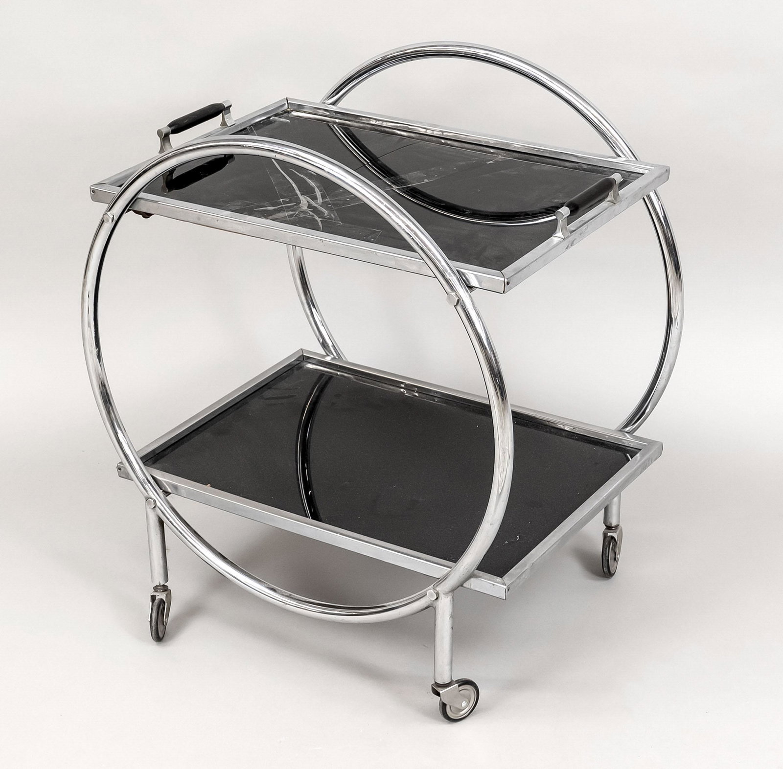 Art deco serving trolley, 1930: Art deco serving trolley, 1930s. Chromed tubular steel, 2 tiers on round frame on casters (casters somewhat loose). Upper tier as removable tray with handles. Glass? of the tray cracked, ca. 62 x 40 x