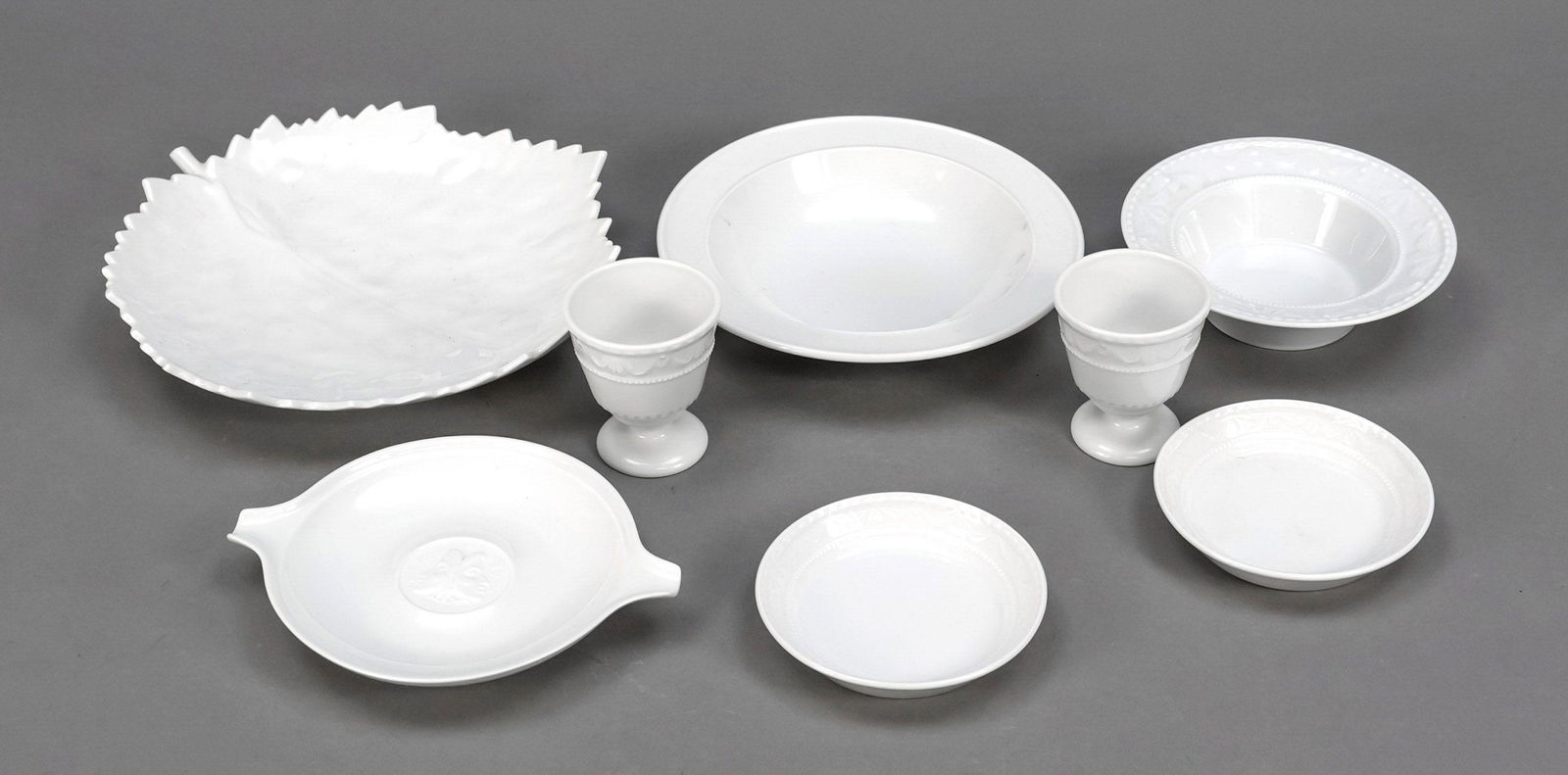 Eight pieces, KPM Berlin, marks 1962-: Eight pieces, KPM Berlin, marks 1962-1992, 2nd choice, white, 2 egg cups, Kurland, h. 6 cm, 2 confectionary bowls, Kurland, Ã˜ 9 cm, 2 round bowls, Ã˜ 12 and 15 cm, 1 leaf bowl, l. 20 cm, 1 ashtra