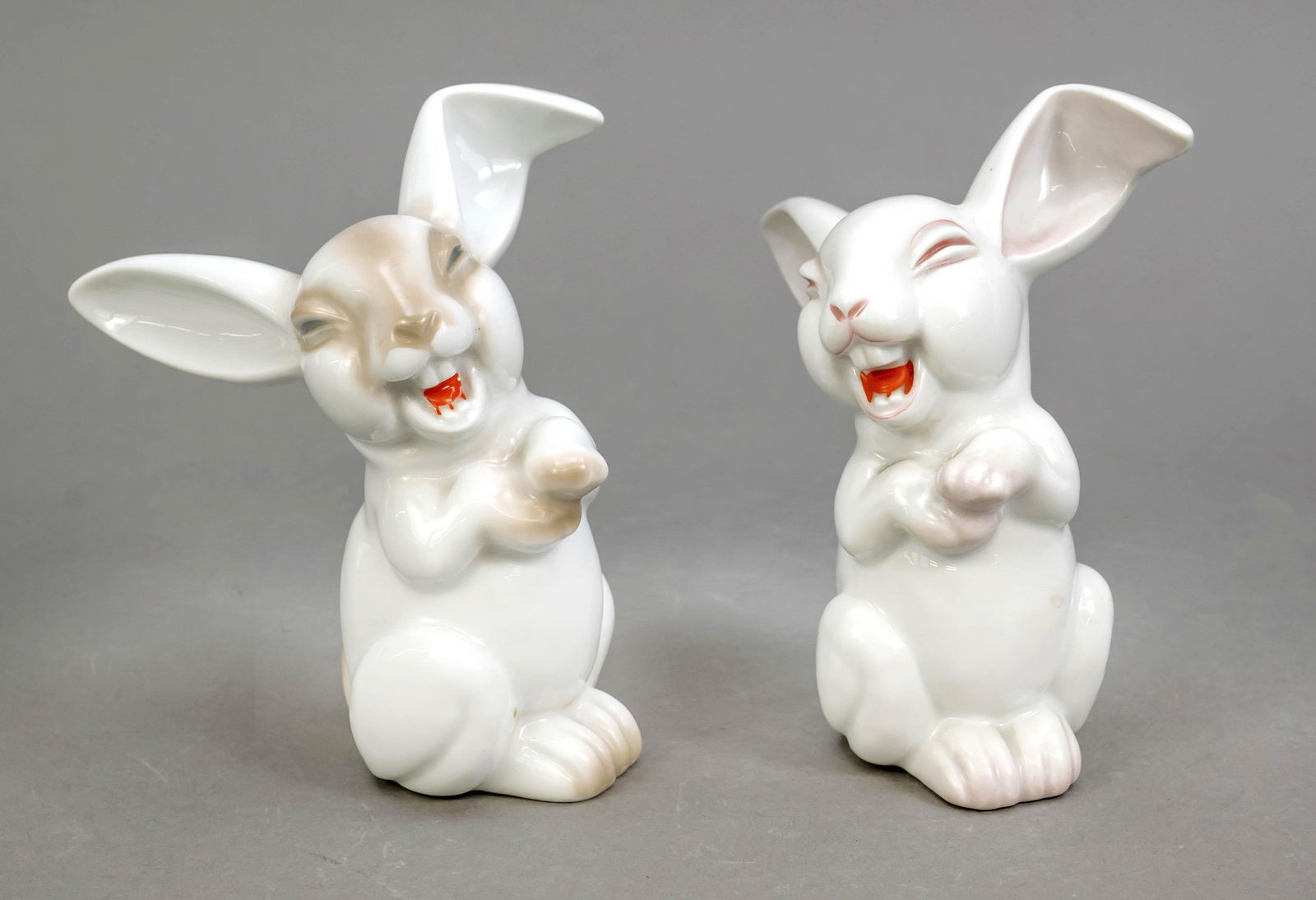 Two laughing rabbits, Rosenthal, 20th: Two laughing rabbits, Rosenthal, 20th c., design M. H. Fritz, white, lightly painted, h. 13 cm