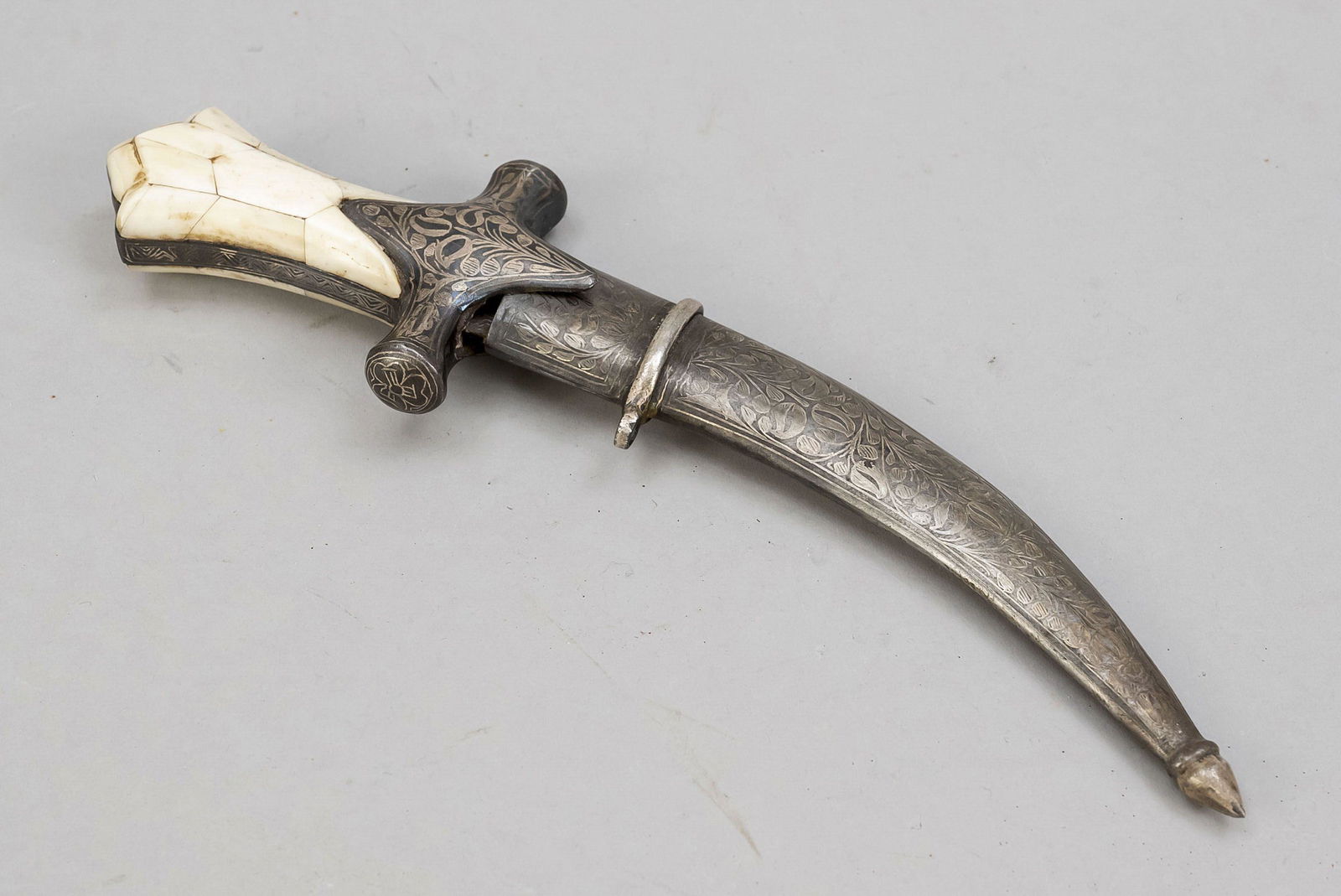Persian scimitar, 19th century, si: Persian scimitar, 19th century, single-edged curved blade (heavily corroded and detached from the hilt). Quillons and scabbard with floral silver inlays, grip scales with bone rest, l. 23 cm.