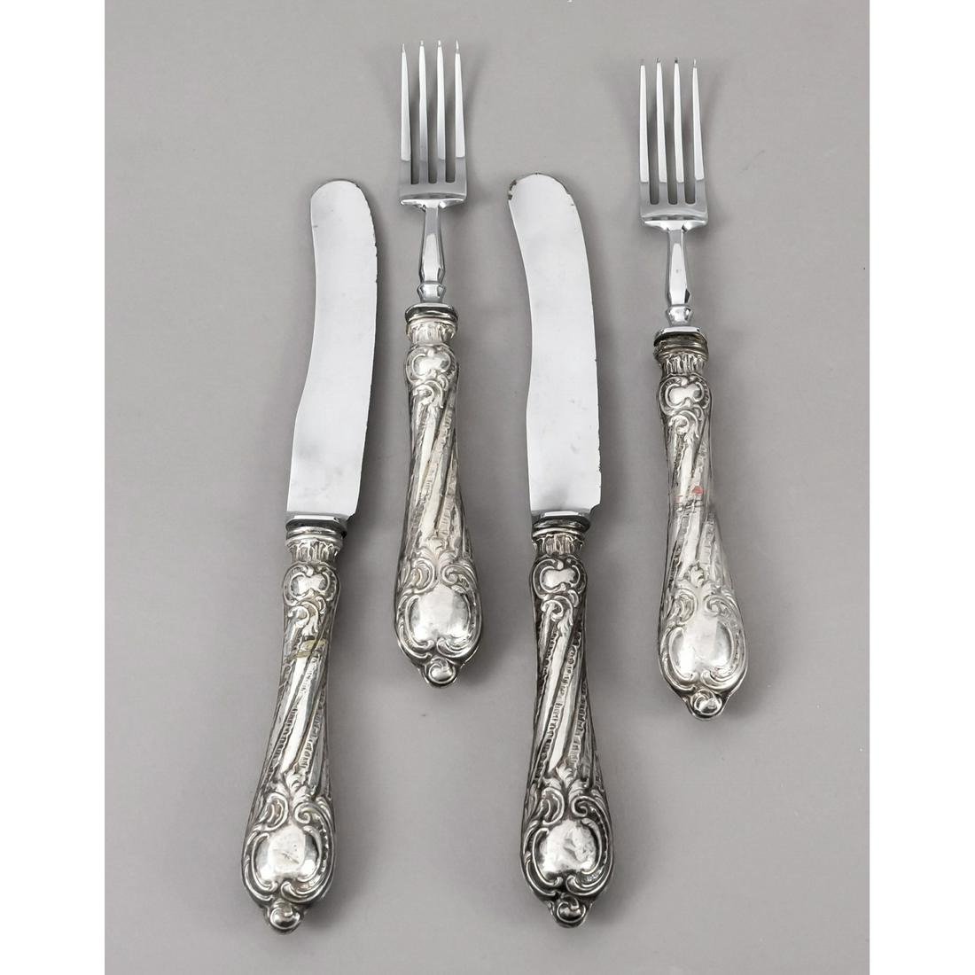 Twelve pieces of cutlery, arou: Twelve pieces of cutlery, around 1900, silver tested 6 knives and forks each, filled handles with ornamental relief decoration, tines and blades replaced, l. to 21 cm