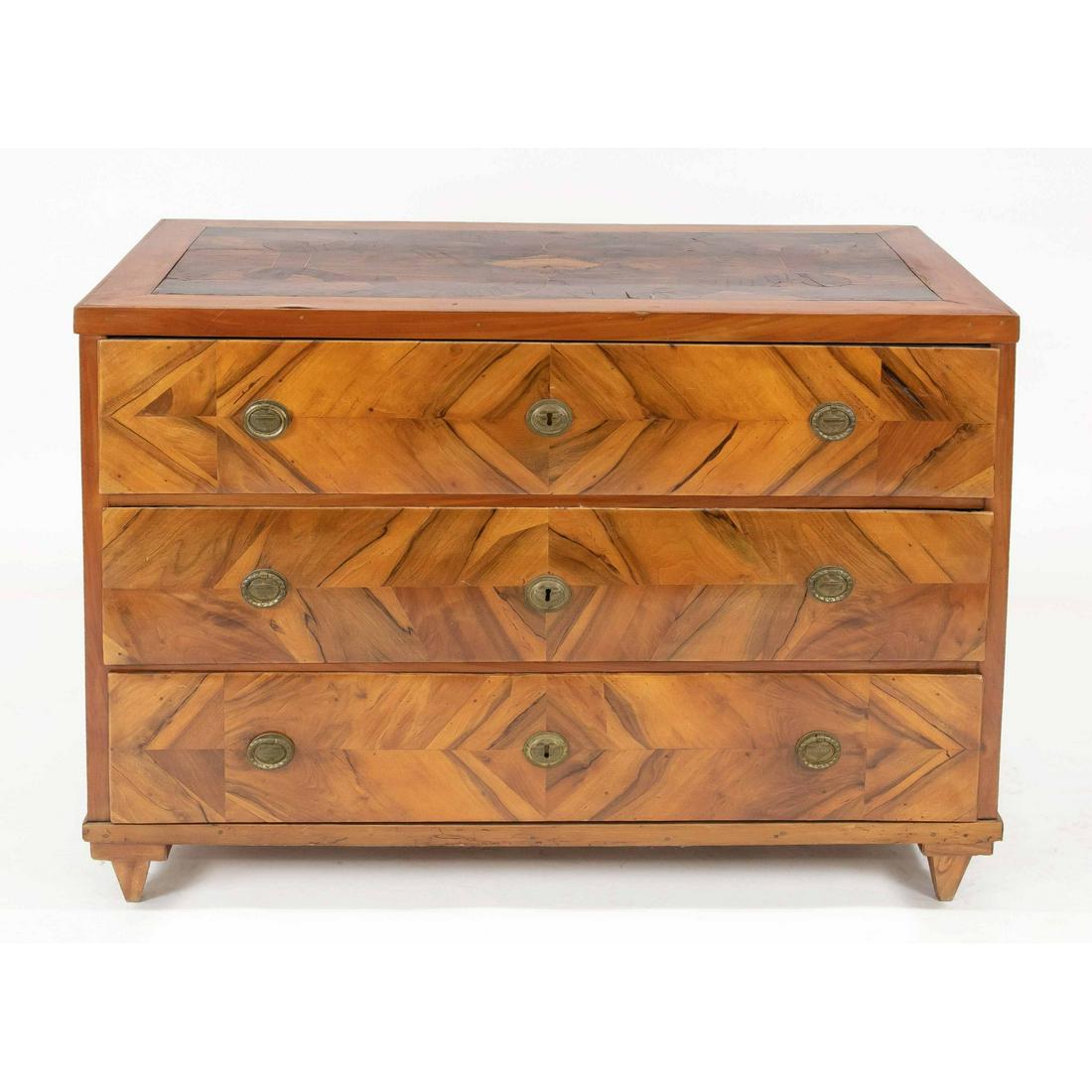 Empire commode around 1800, wa: Empire commode around 1800, walnut veneered, top inlaid with various precious woods, 83 x 116 x 61 cm.- The furniture cannot be viewed in our rooms.