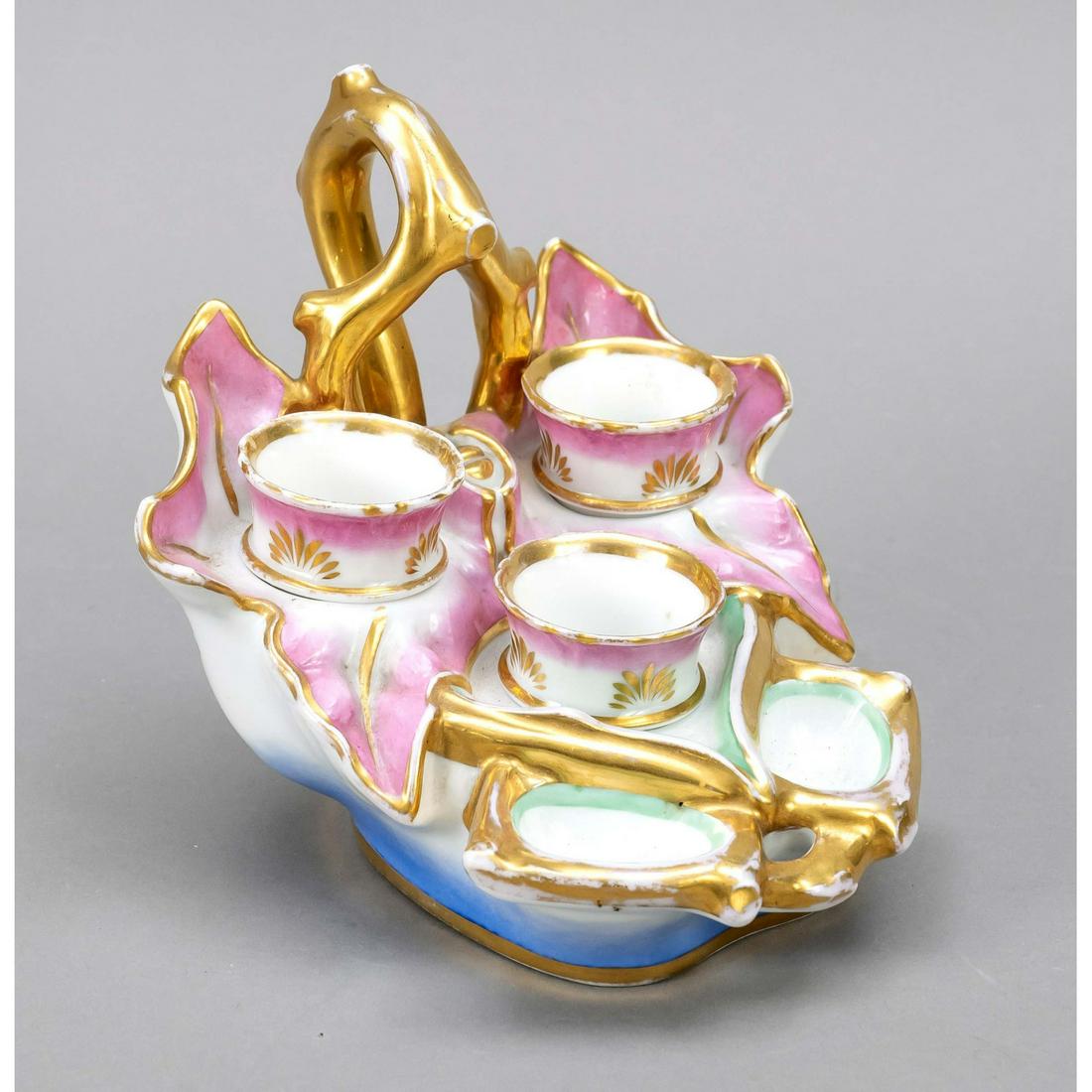 Table decoration, around 1900, egg: Table decoration, around 1900, egg cup holder in leaf shape, with 3 egg cups and 2 deepenings for salt, partly pink, blue and green forn, ornamental gilding (rubbed), l. 17 cm
