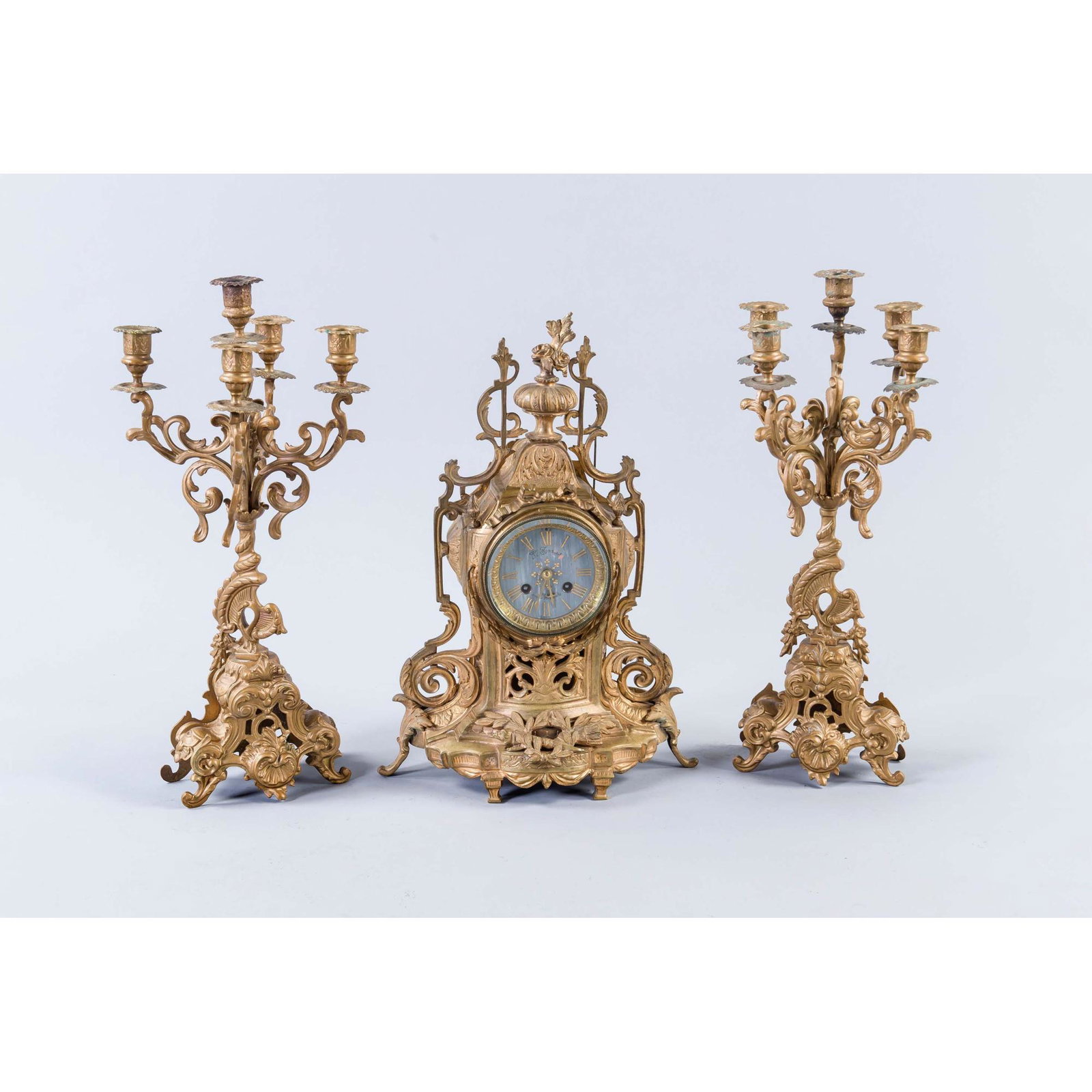 Historicist pendulum with two side: Historicist pendulum with two side plates, France, end of the 19th century, bronzed metal case with typical decoration of the time, behind a glass door a beaded bezel framing a grey marble-look lacque