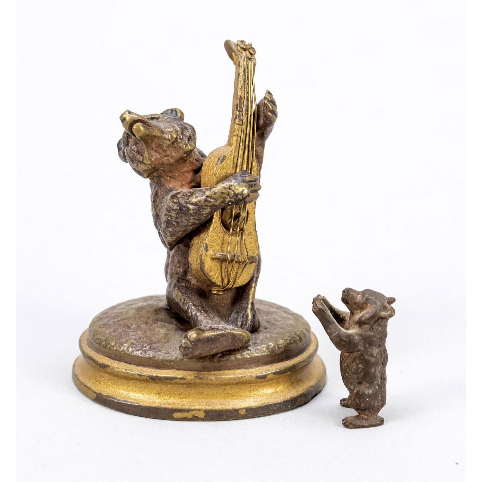 Two small bronzes in the shape of b (1 of 2)