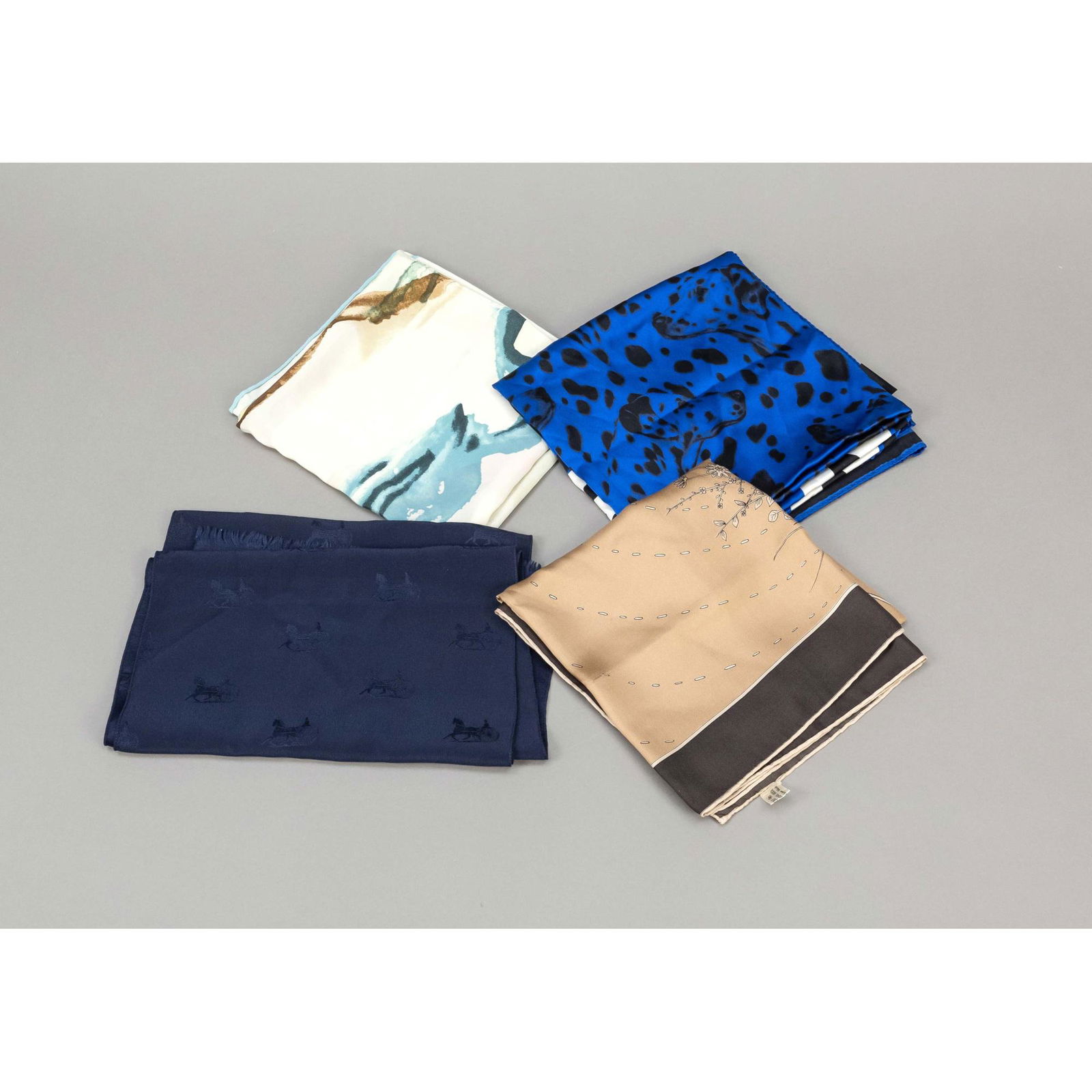 Escada, Celine a.o., 3 polychrome p: Escada, Celine a.o., 3 polychrome patterned square shawls and 1 scarf, slight signs of storage, partly minimally stained, to approx. 87 x 87 cm.