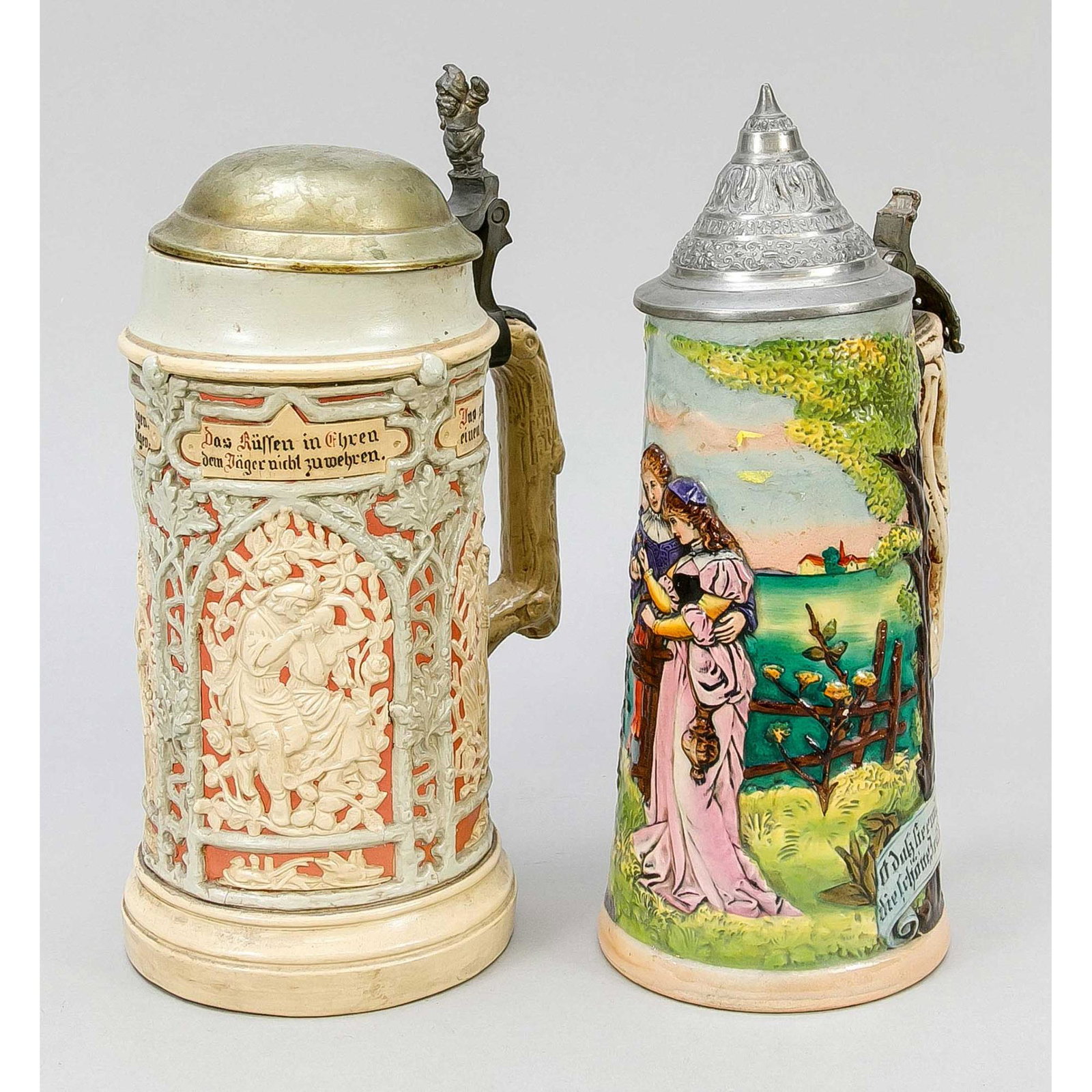 2 stoneware jugs, Germany, 1 x Met: 2 stoneware jugs, Germany, 1 x Mettlach, 1 x Wick Werke. Both decorated all around and polychrome painted, on one the pewter lid is separated from the thumb rest (soldered joint), h. up to 26 cm.