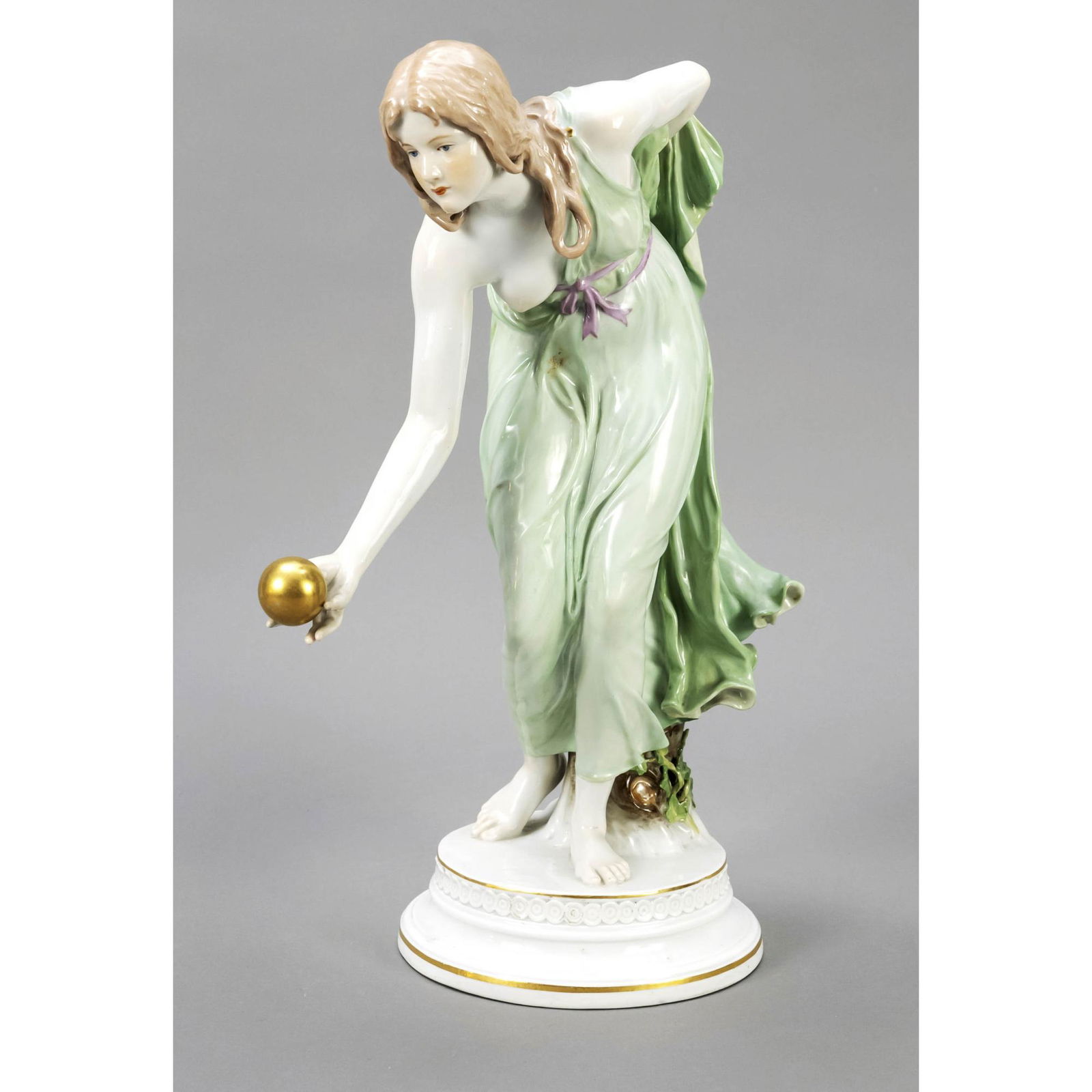 Ball player, Meissen, Knauf period (: Ball player, Meissen, Knauf period (1850-1924), 2nd choice, designed by Walter Schott (1861 Ilsenburg - 1938 Berlin), first made in 1897. Moving figure of a young lady throwing a golden ball, on a pro
