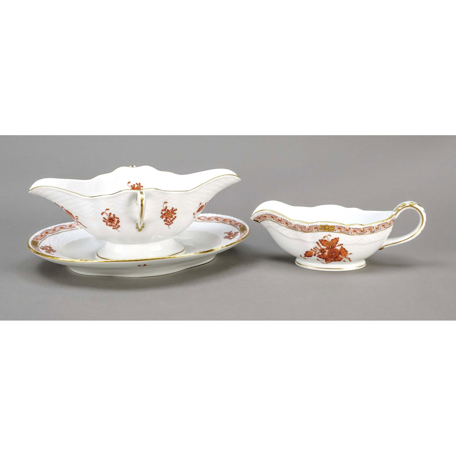 Two sauce boats, Herend, mark after: Two sauce boats, Herend, mark after 1967, form Ozier, decor Apponyi in red, ornamental gilding, sauce boat with solid base, l. 24 cm, hand sauce boat, l. 18 cm