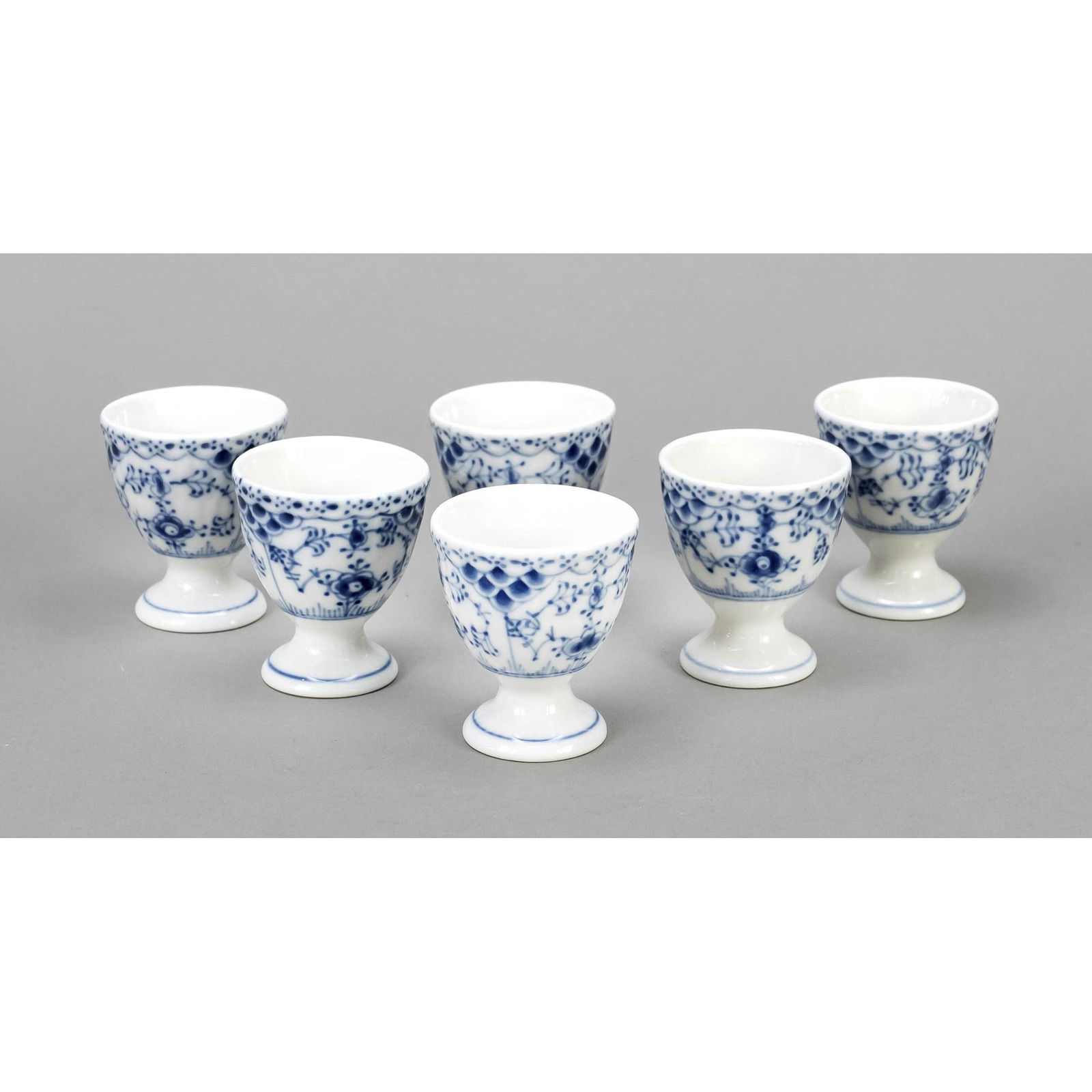 Six egg cups, Royal Copenhagen, Denm: Six egg cups, Royal Copenhagen, Denmark, 20th century, dÃ©cor Musselmalet half-tip in underglaze blue, h. 6 cm