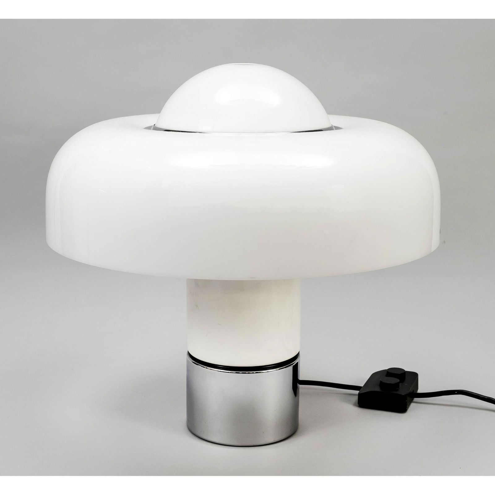 Designer table lamp, model Brumbury: Designer table lamp, model Brumbury, design Luigi Massoni for Harvey Guzzini, Italy. 1970s. Base of chromed and white lacquered metal, shade of white transparent plastic, on the shade label ''IGuzzini