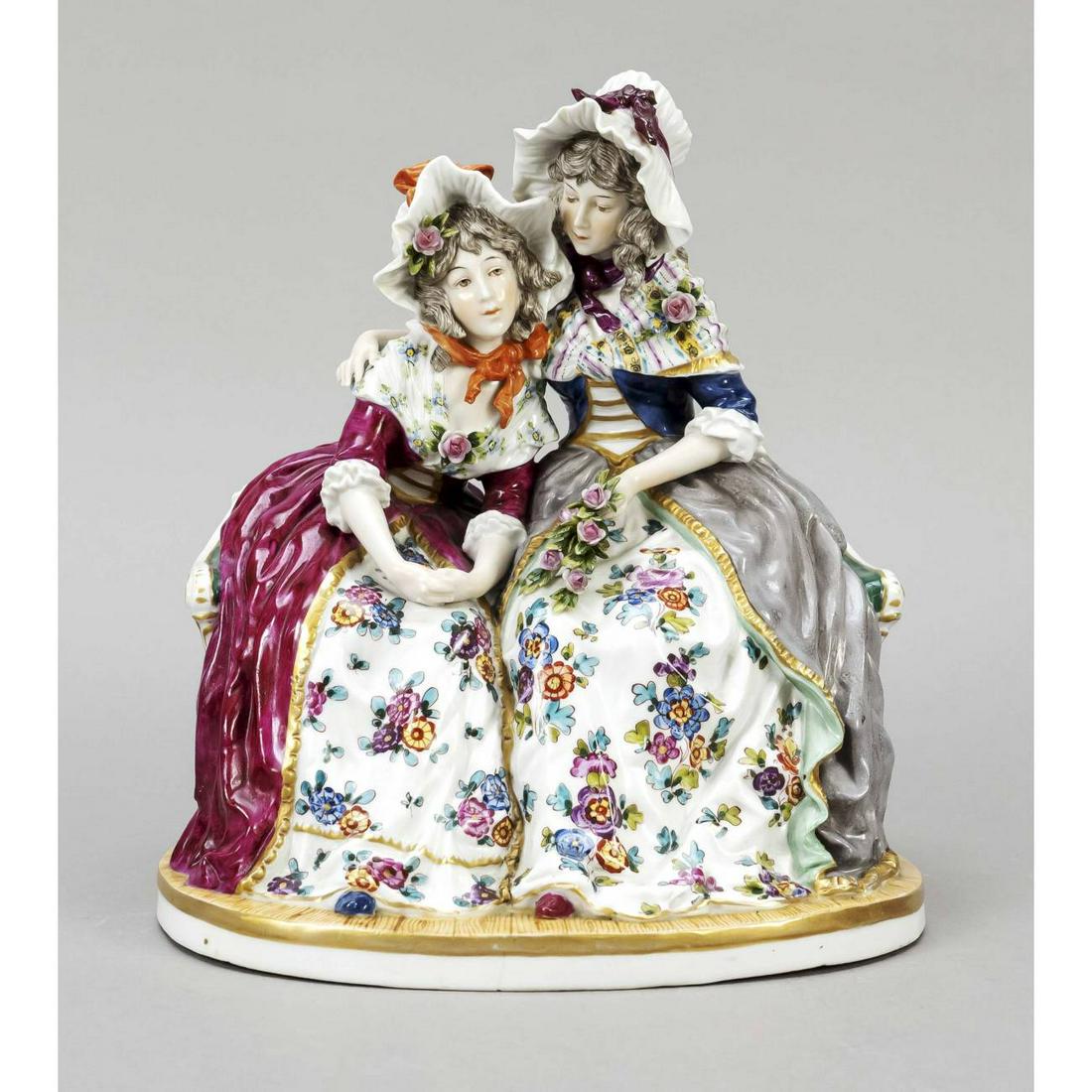 Two sisters sitting on a park ben (1 of 2)