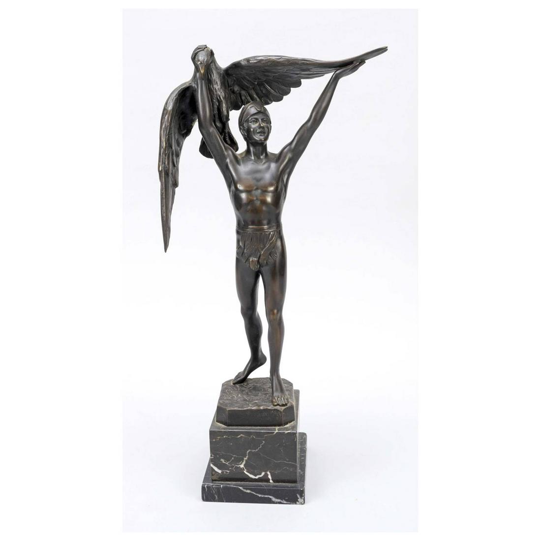 Gustav Schmidt-Cassel (1867-1954),: Gustav Schmidt-Cassel (1867-1954), youth dressed in loincloth and helmet, proudly holding up a hunted eagle, patinated bronze, signed on stand, on marble base, h.m. 53 cm