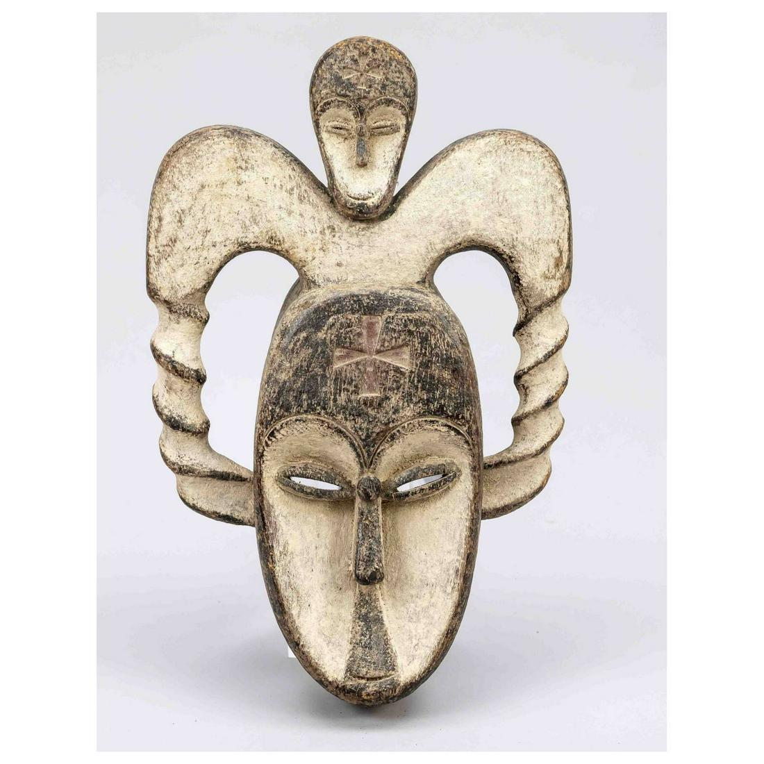 African wooden mask, probably Ivor: African wooden mask, probably Ivory Coast(Guro?), wood carved mask of a horned man with skull attachment, kaolin and ocher painting, 37x23cm