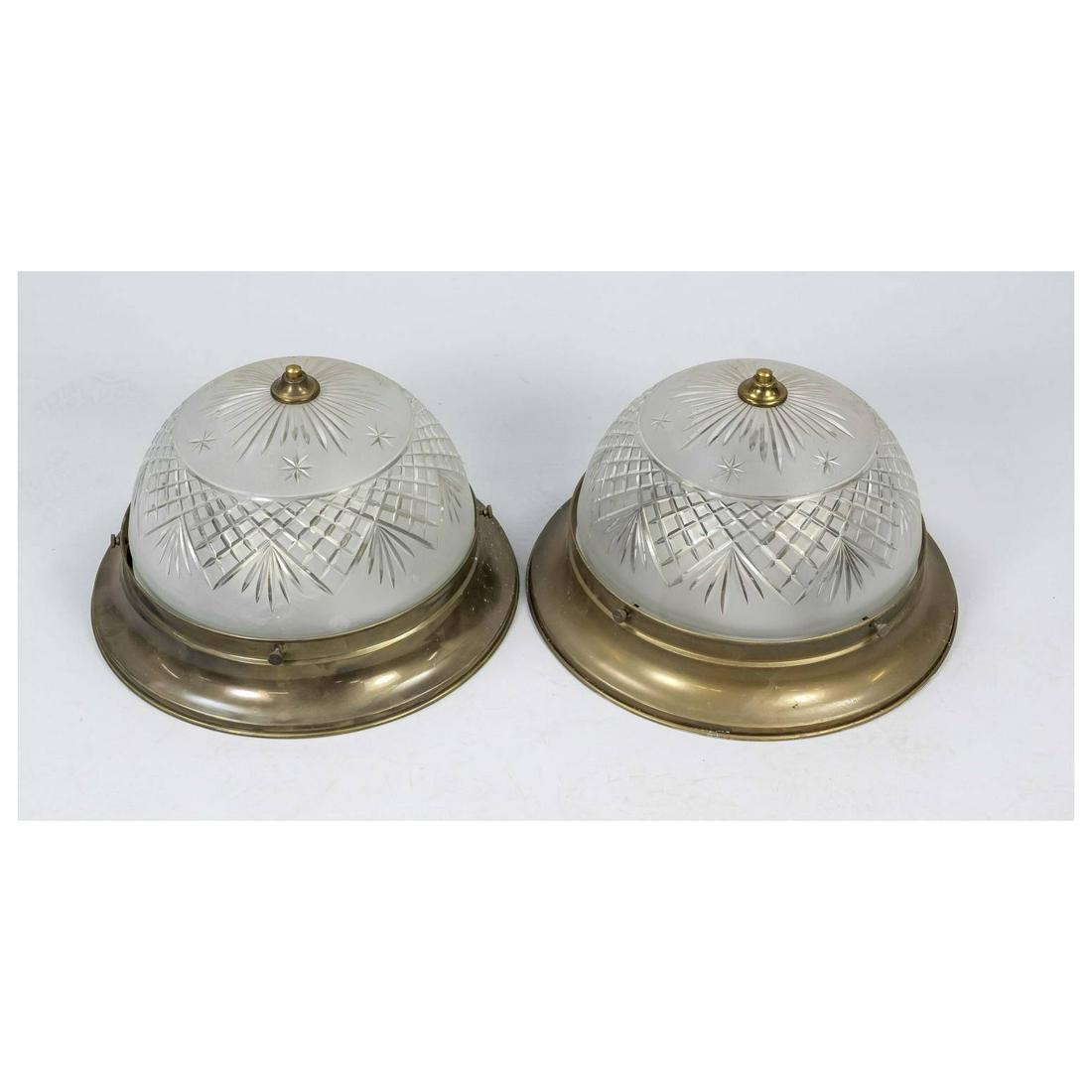 Pair of plafoniers, 20th c. Lightl: Pair of plafoniers, 20th c. Lightly profiled brass frame, etched glass shade with cut decoration, each 2-light, d. each 39 cm.
