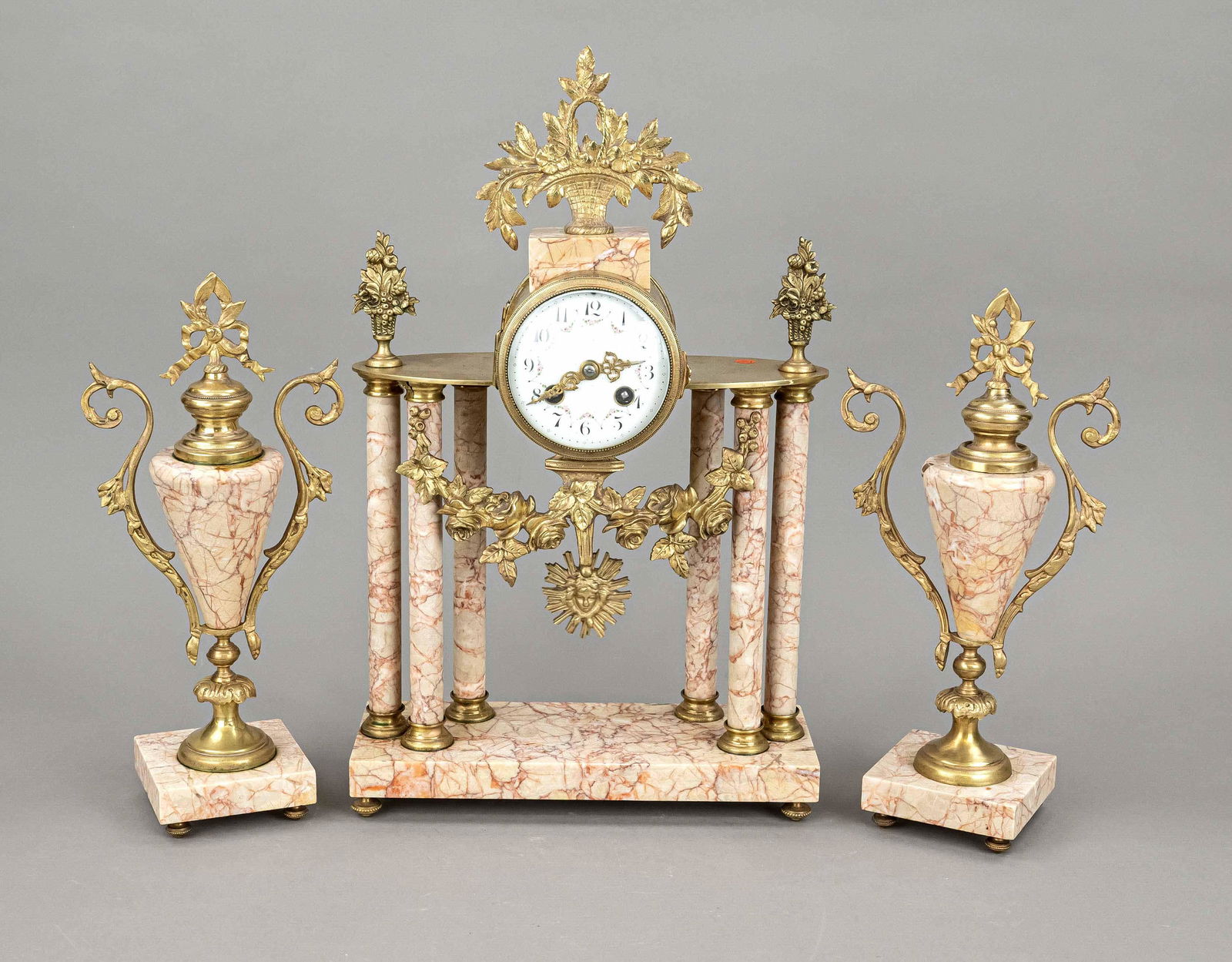 3-piece french. Marble column clock set, 2nd h.19th c., rose'-red/brown marble, decorated with: 3-piece french. Marble column clock set, 2nd h.19th c., rose'-red/brown marble, decorated with gilded vines and flower baskets, white dial with black arab. numerals and polychrome vine painting, gilde