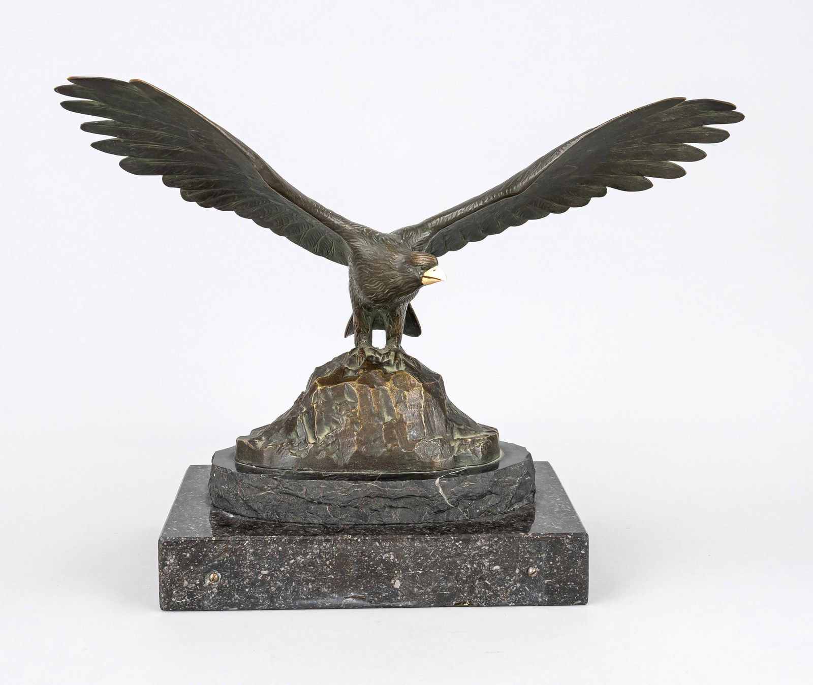 Otto Poertzel (1876-1963), large eagle, model on rock with impressively spread wings, golden brown: Otto Poertzel (1876-1963), large eagle, model on rock with impressively spread wings, golden brown patinated bronze on marble and granite plinth, beak made of bone, signed ''Prof. Poertzel'' on verso