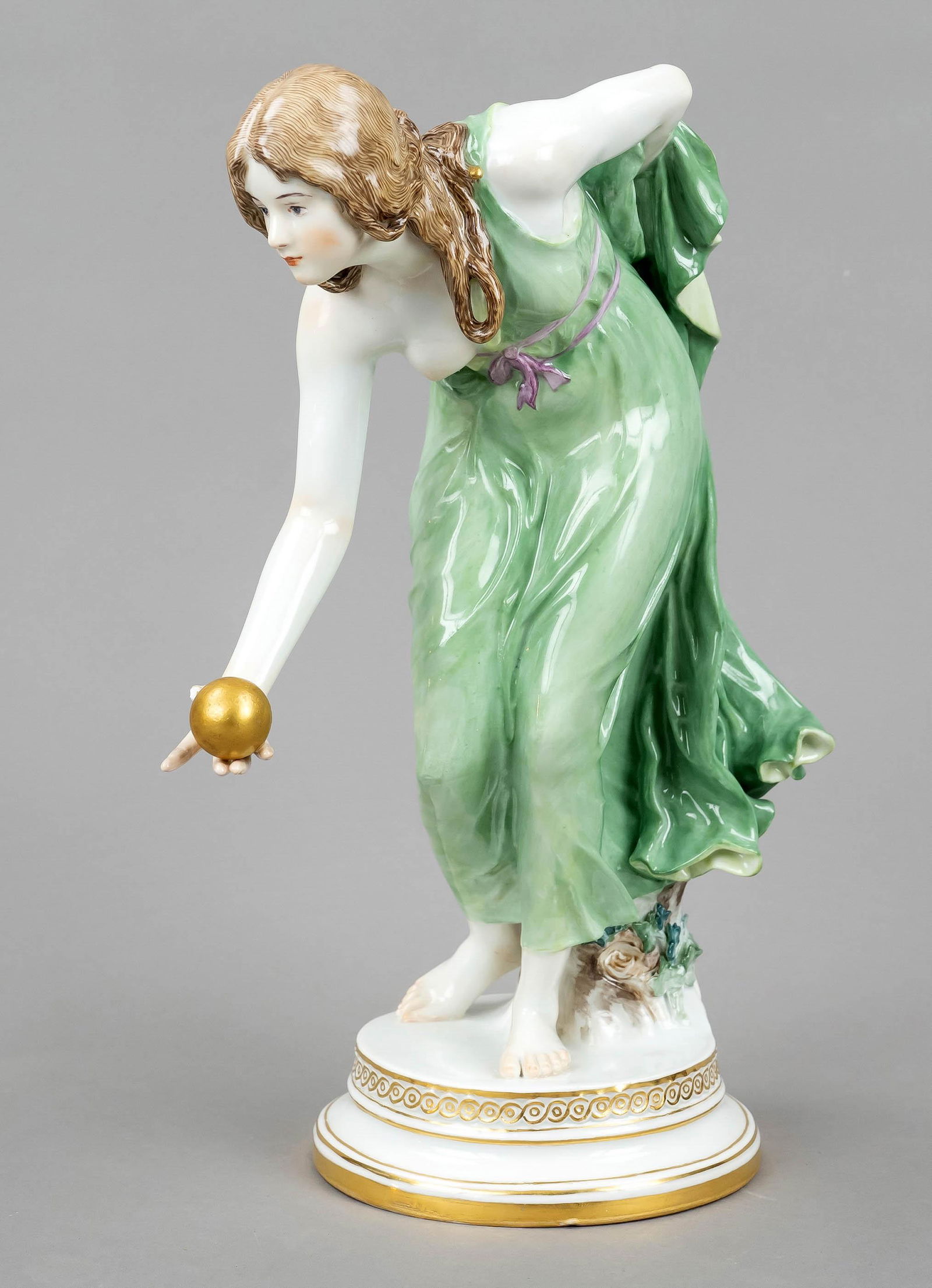 Ball player, Meissen, mark aft: Ball player, Meissen, mark after 1934, 1st choice, design by Walter Schott (1861 Ilsenburg - 1938 Berlin), first form 1897. Moving figure of a young lady throwing a golden ball, on a profiled round ba