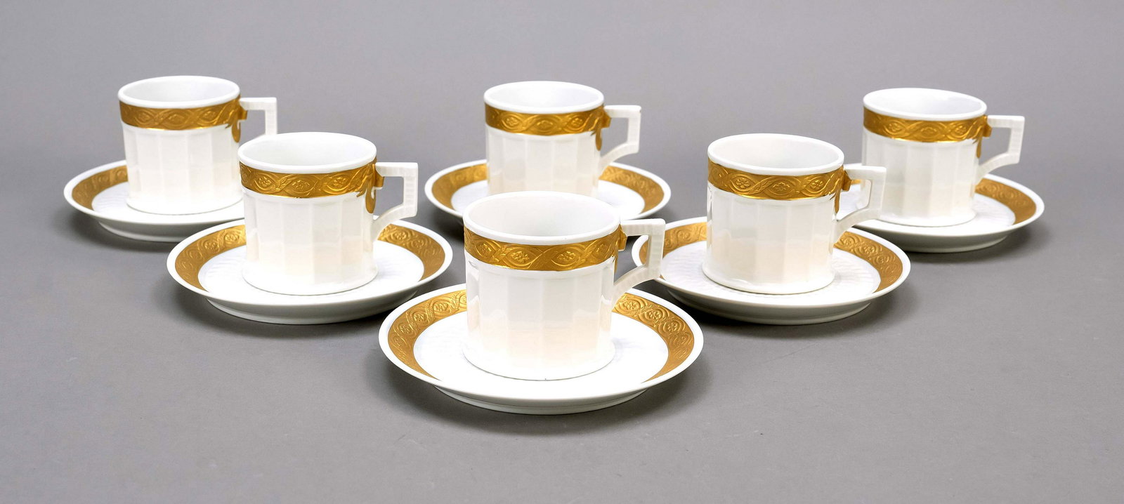 Six cups with saucers, Royal C: Six cups with saucers, Royal Copenhagen, Denmark, marks 1969-79, classicistic form, design Arnold Krog 1909, fluted cylindrical cups, UT with fan relief in mirror, white, surrounding relief border in